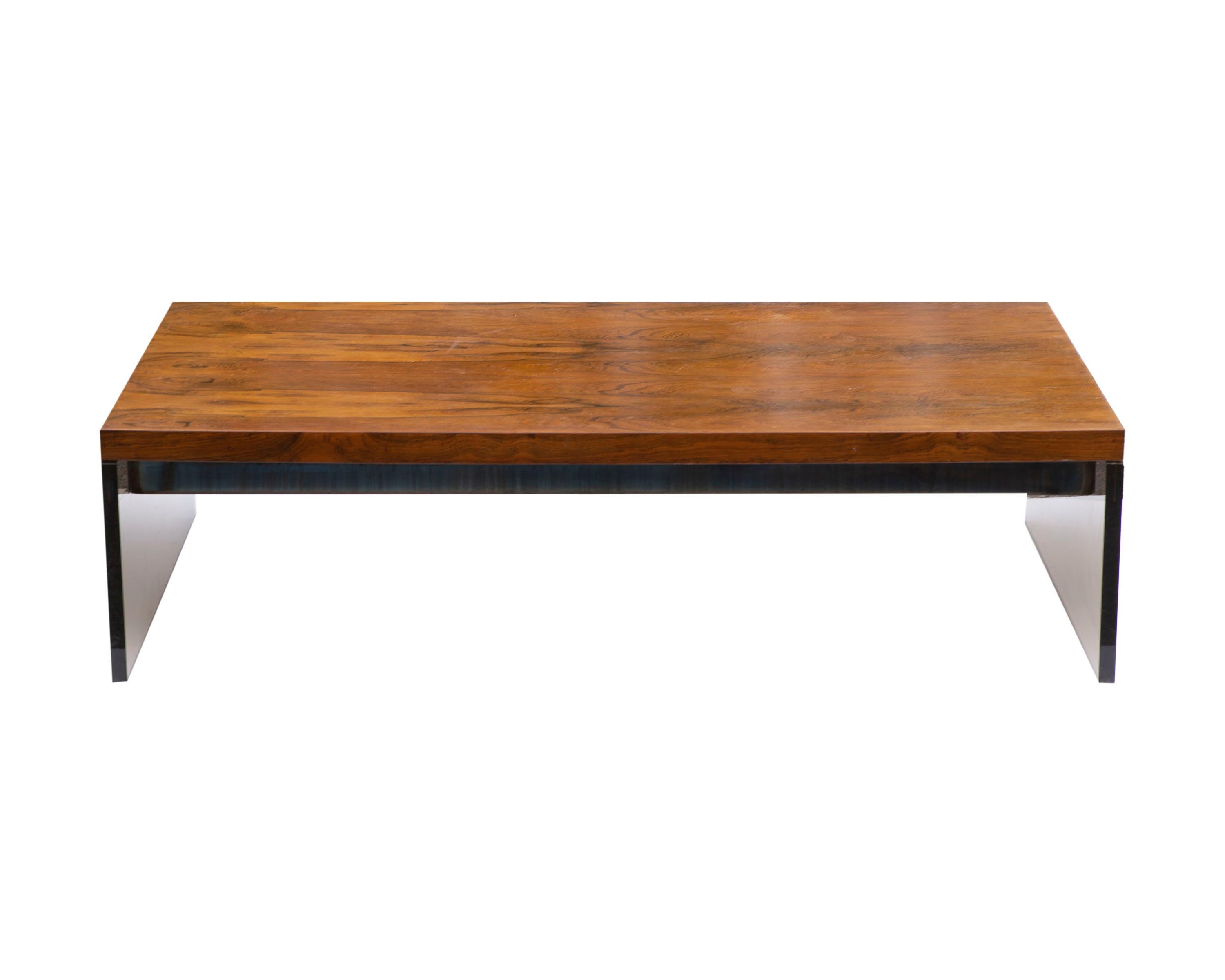 A Mid-Century Modern Environment 70 coffee table designed by Milo Baughman (1923-2003) for Thayer Coggin. The substantial rectangular table features a wood top with a dark stain. Two metal stretchers support the table top. The coffee table rests