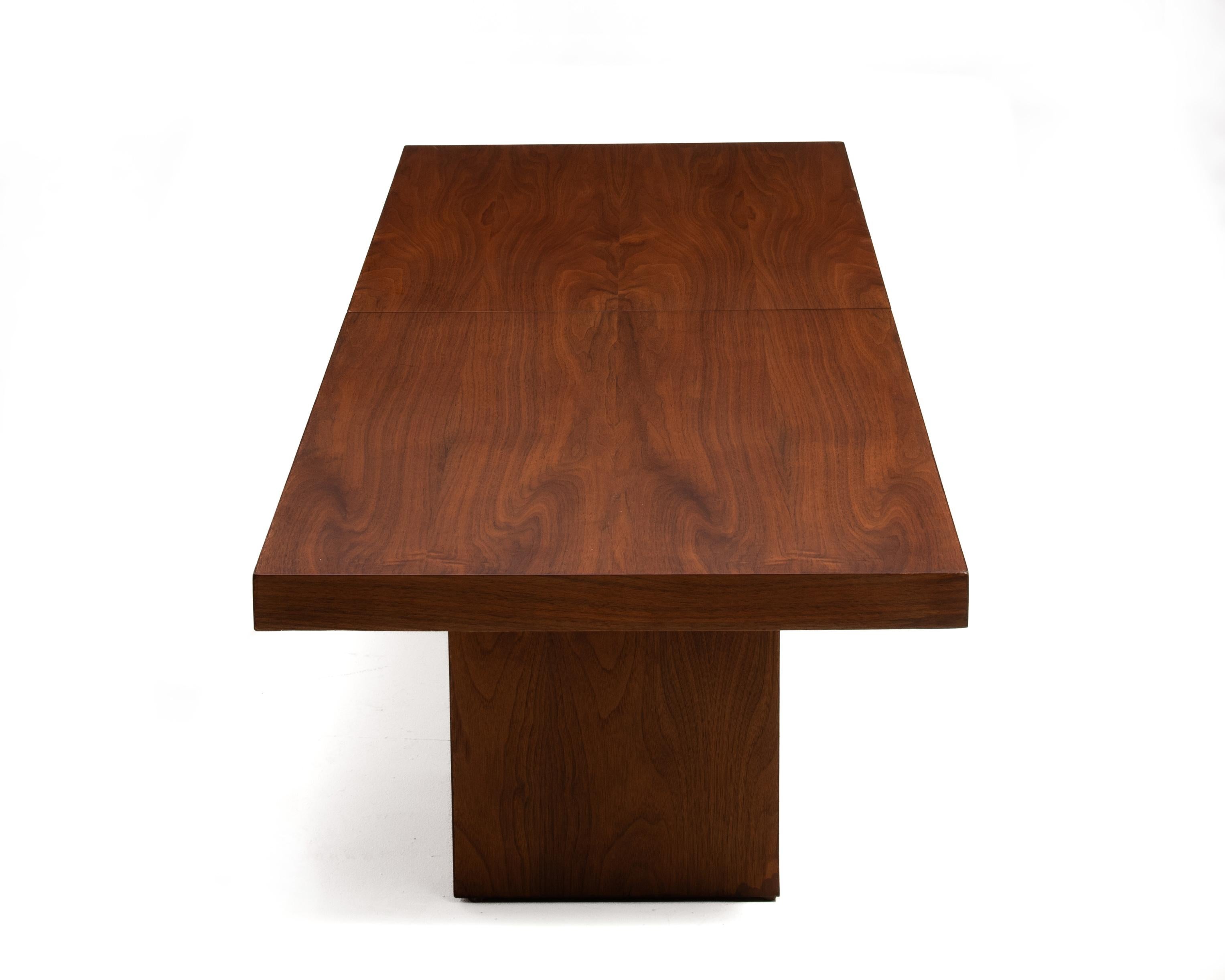 A restored Milo Baughman for Thayer Coggin Walnut coffee or cocktail table with a thick top and dual pedestal base. Walnut veneer with excellent wood selection throughout. This unique table opens to reveal a 24