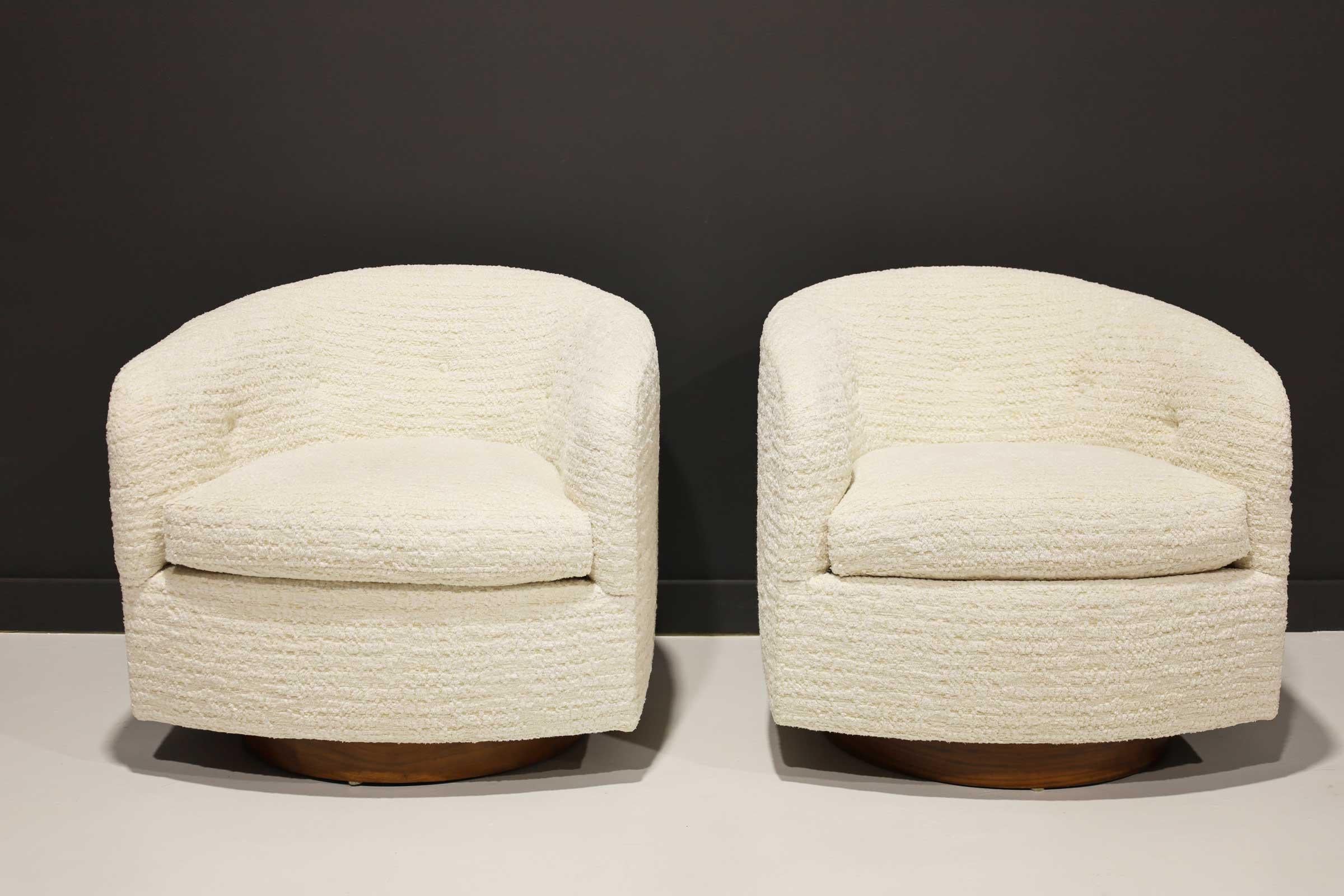 Milo Baughman's iconic tilt swivel newly upholstered in a off-white fluffy boucle by Kelly Wearstler. This chair has a walnut base and perfect proportions.
