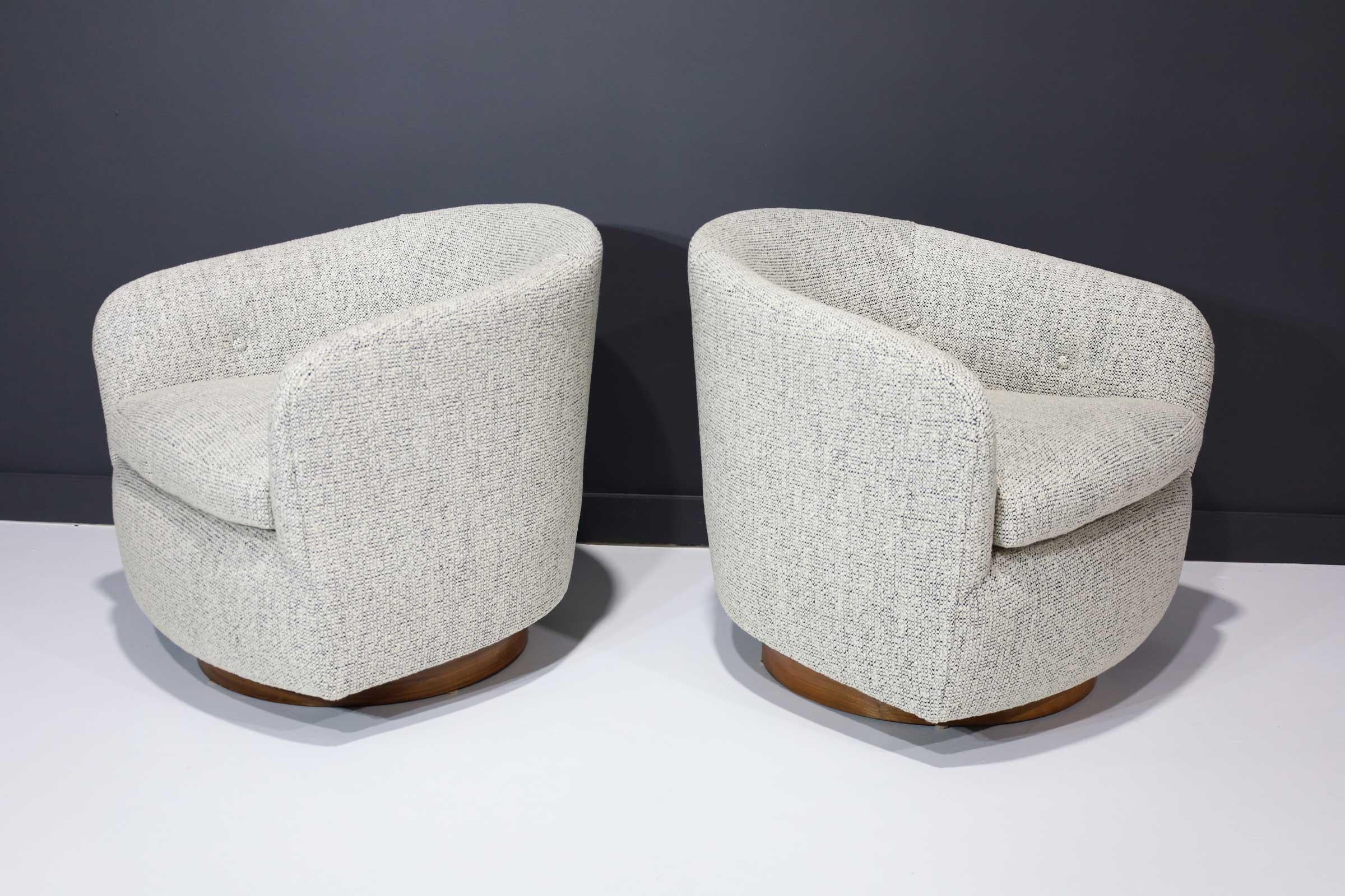 Newly reupholstered in high quality boucle like black and white texture. Walnut bases.