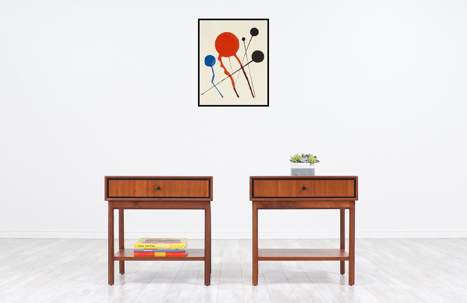 Spectacular pair of vintage nightstands designed by American architect and designer Milo Baughman in collaboration with Arch Gordon in the 1960s. Our nightstands are crafted in warm walnut wood that features single dovetailed drawers with Baughman's