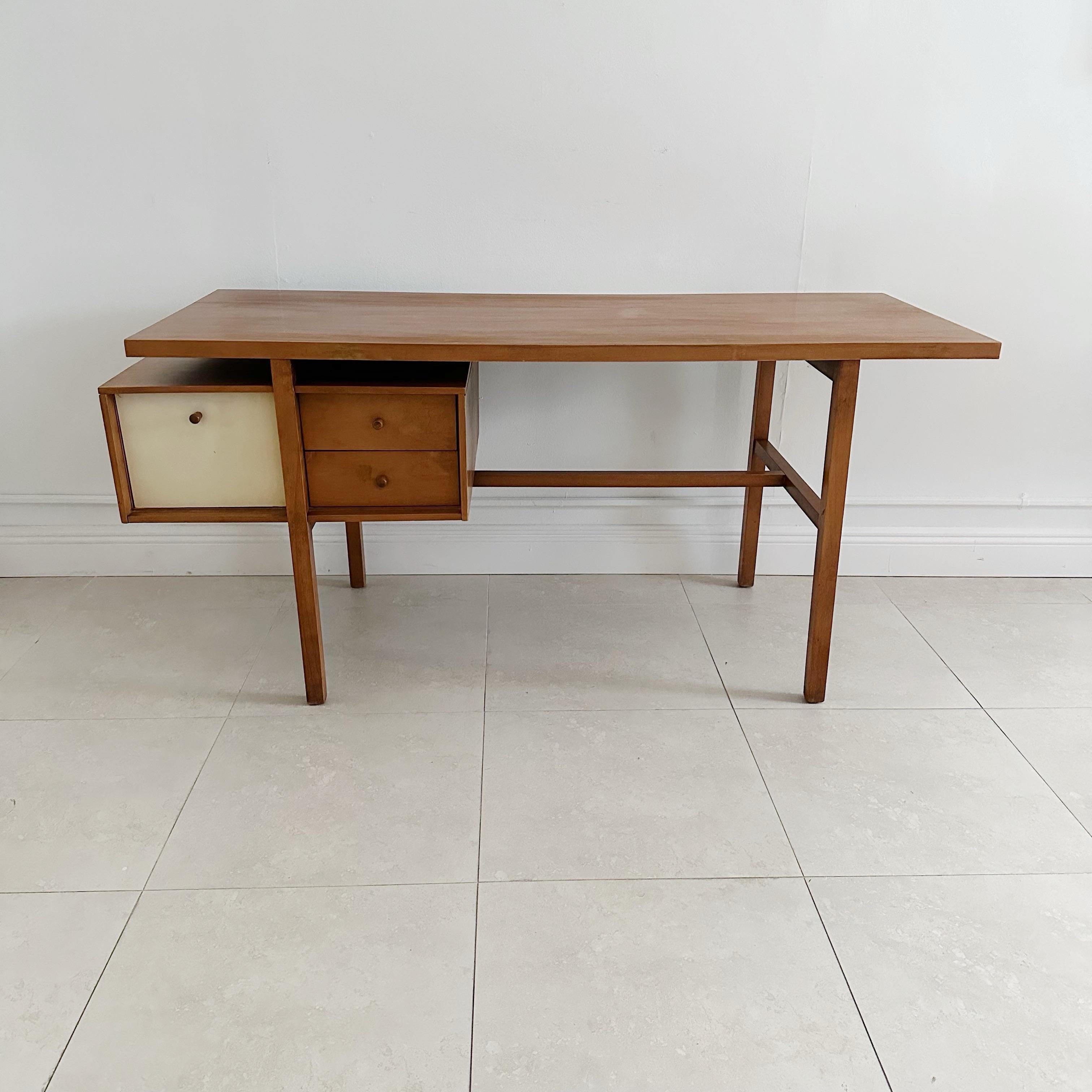 Milo Baughman walnut desk from the 1950s for Genn of California. Features 3 floating drawers. Knee hole measures 26
