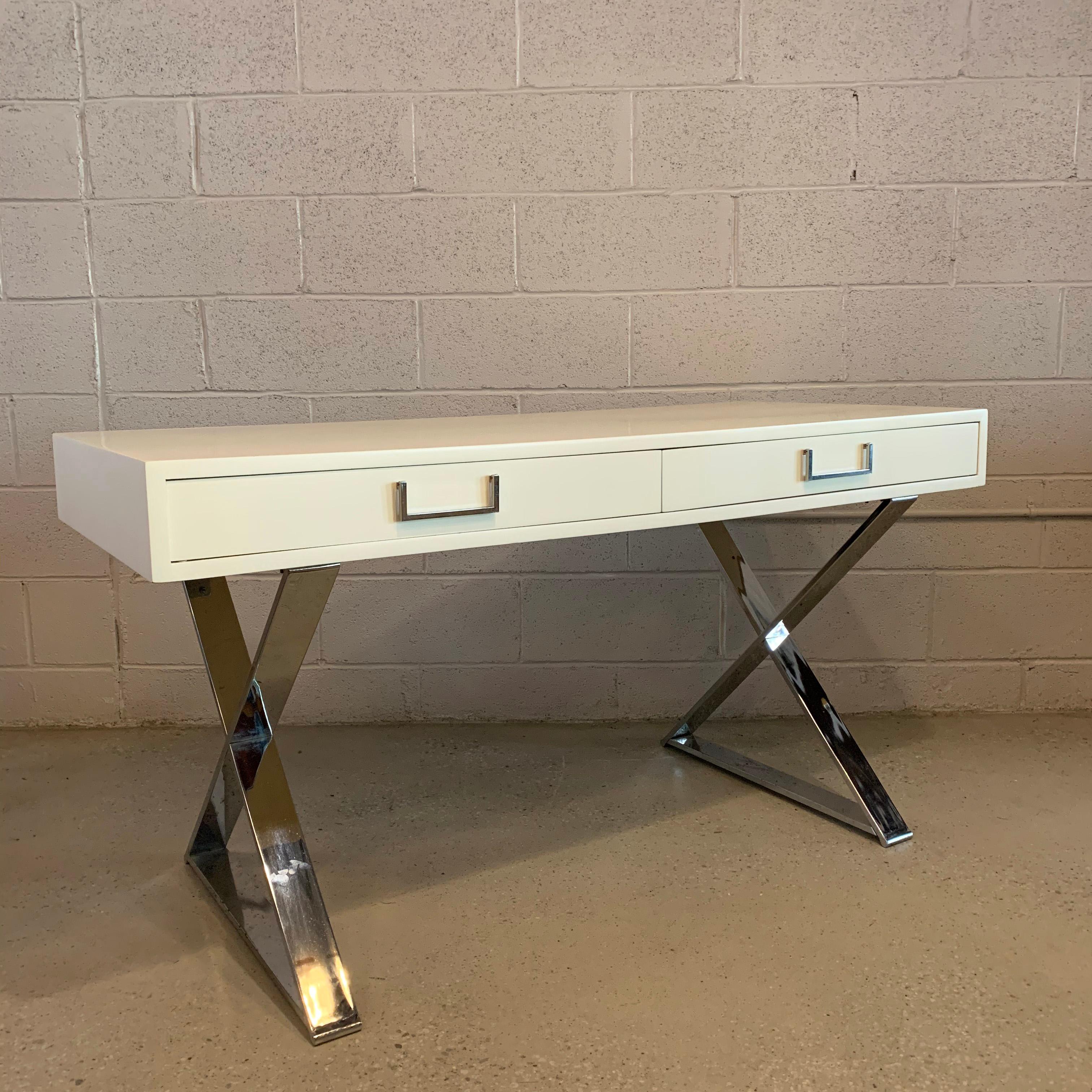 Mid-Century Modern, Campaign desk by West Michigan Furniture Company features a white lacquered top with 2 drawers with chrome hardware on chrome X bases. Height to bottom of desk is 23.75 inches.