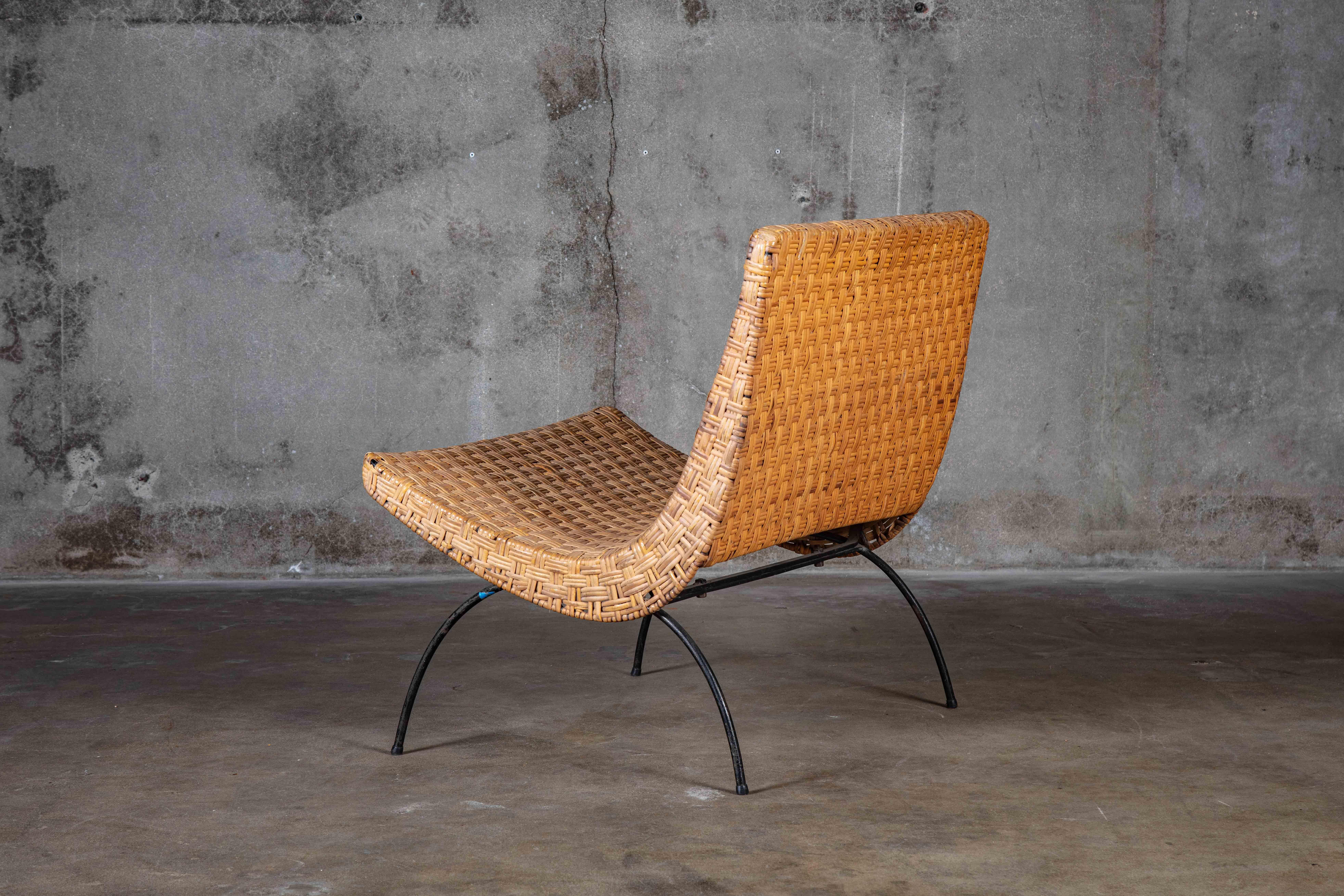 Milo Baughman enameled steel and woven cane lounge chair

Size: Seat 10