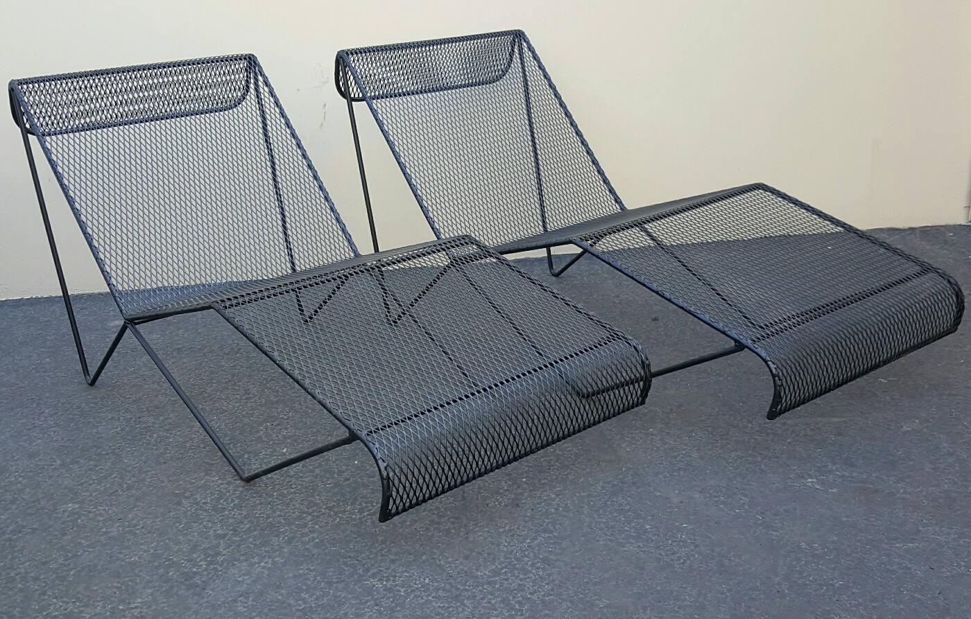 Sculptural pair of vintage wrought iron and Mesh Chaise lounges.

Milo Baughman Style Chaise Lounges by For Pacific Ironworks.

Although there is no label, Many collectors of California modern design have told us that they
agree that the Lounges are