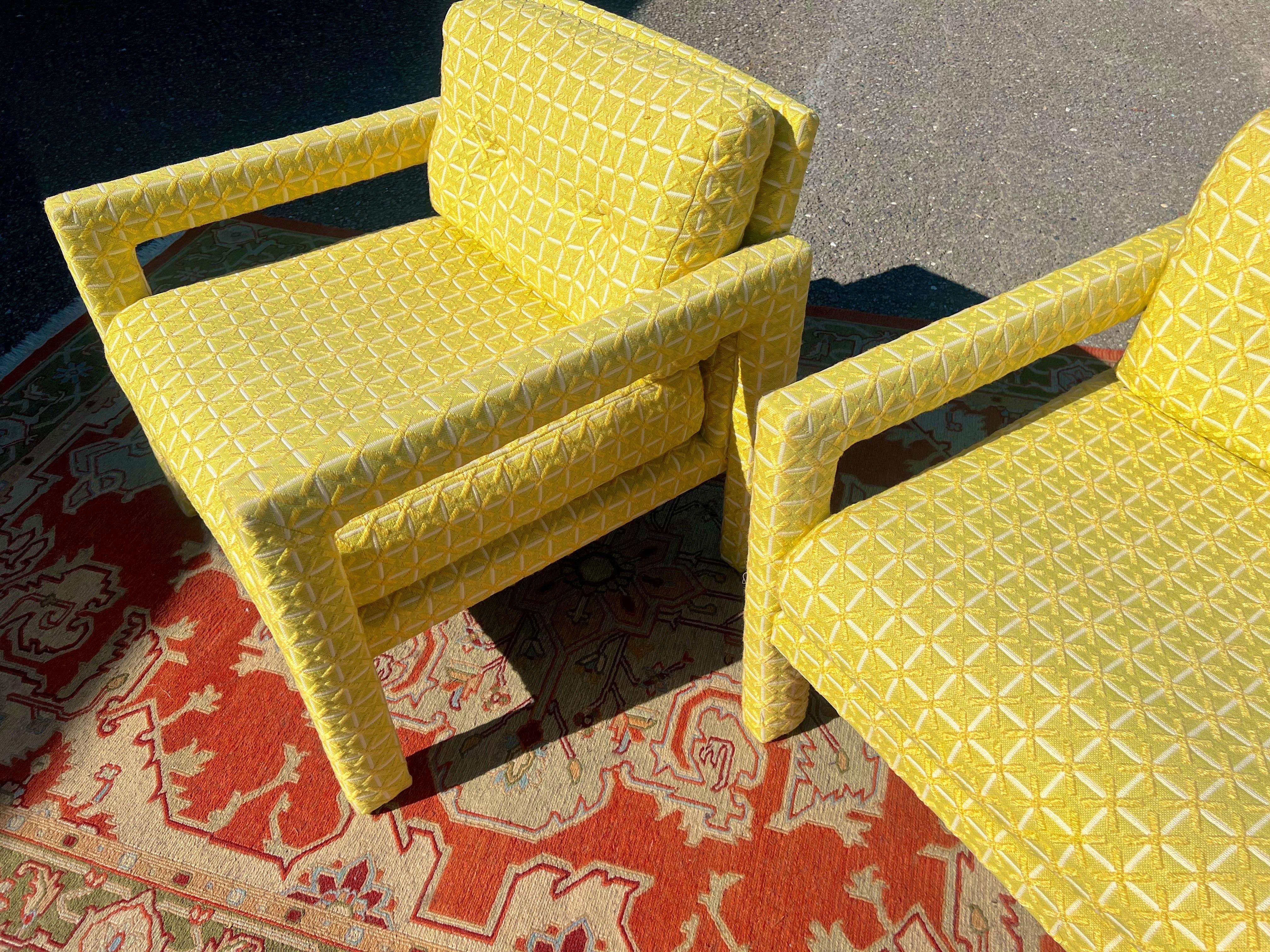 A sunny pair of mid-century Milo Baughman parsons chairs. Original upholstery in a lemon and lime and white pattern.
