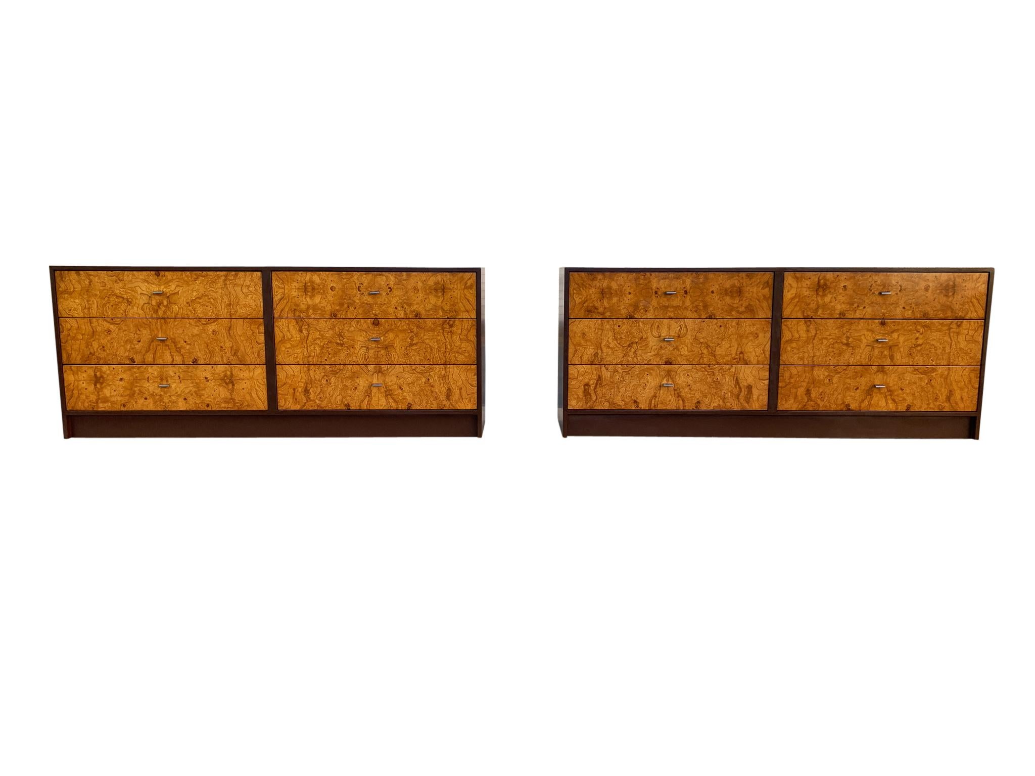 A super handsome and sophisticated pair of six-drawer dressers or credenzas. They feature well-made and freshly refinished brown enamel cases, with beautifully book matched olive-burl drawer fronts, and elegant chrome pulls. The scale, functionality