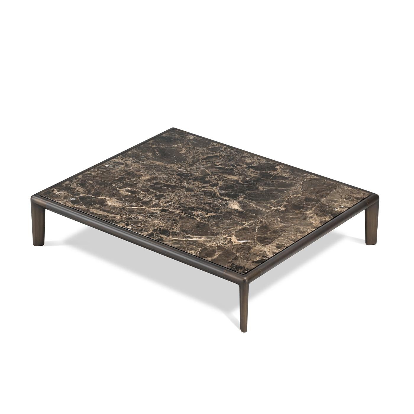 Best paired with the plush modern sofa from the Ghidini catalog for a refined, coherent designer look, this rectangular coffee table is distinguished by a sleek structure ennobled by the presence of a prized tabletop in Dark Emperador marble,