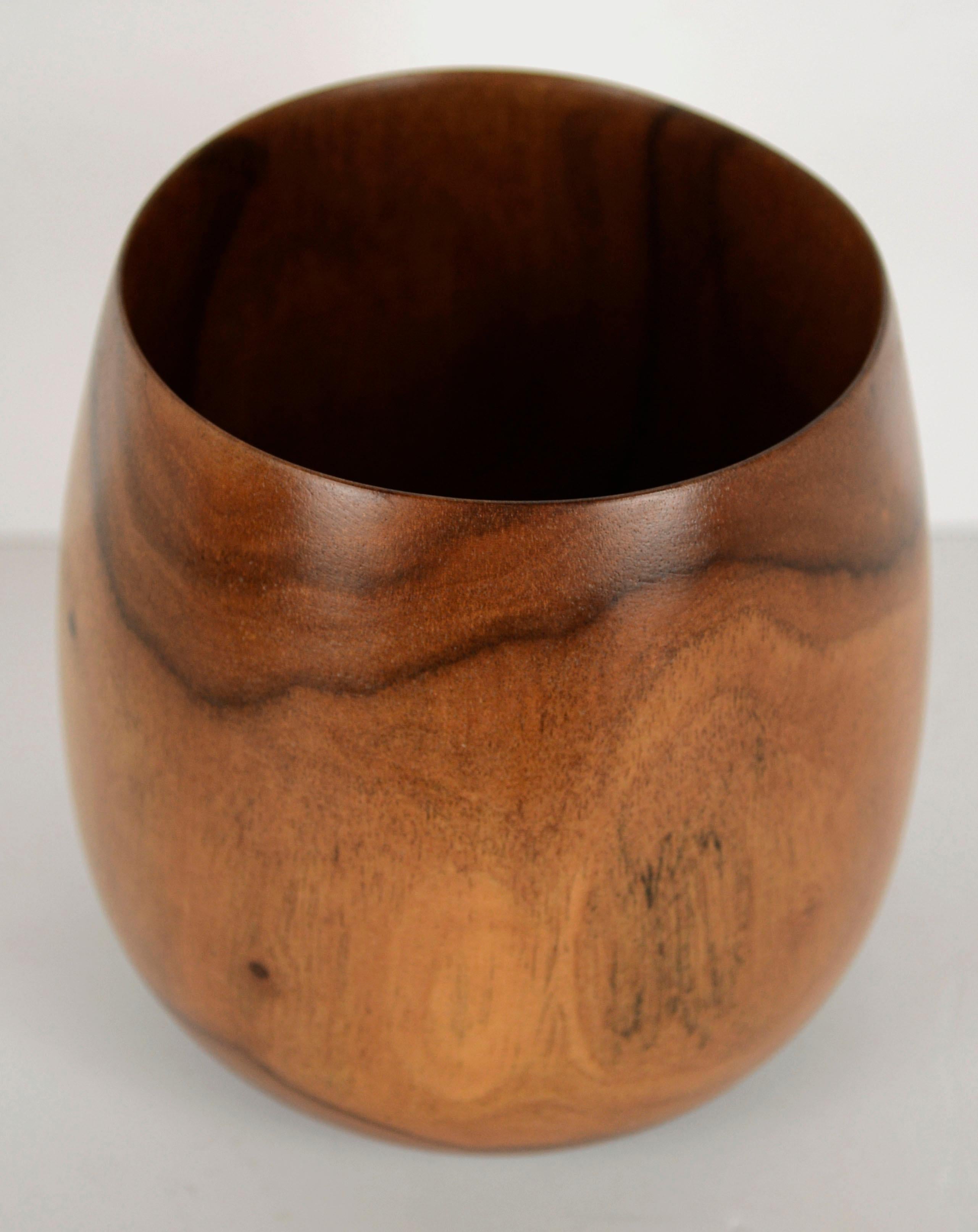 One-of-a-kind hand turned wood bowl, hand made from Hawaiian milo wood, by Big Island wood craftsman Joseph Mathieu (American, b.20th Century). Milo, also known as Pacific rosewood, has a gorgeous patterned woodgrain that is featured beautifully in