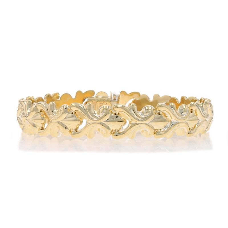 Brand: Milor

Metal Content: 14k Yellow Gold

Bracelet Style: Link
Fastening Type: Tab Box Clasp with One Side Safety Clasp
Theme: Fan Scroll
Features: Hollow construction for comfortable, all day wear

Measurements

Length: 7 1/4