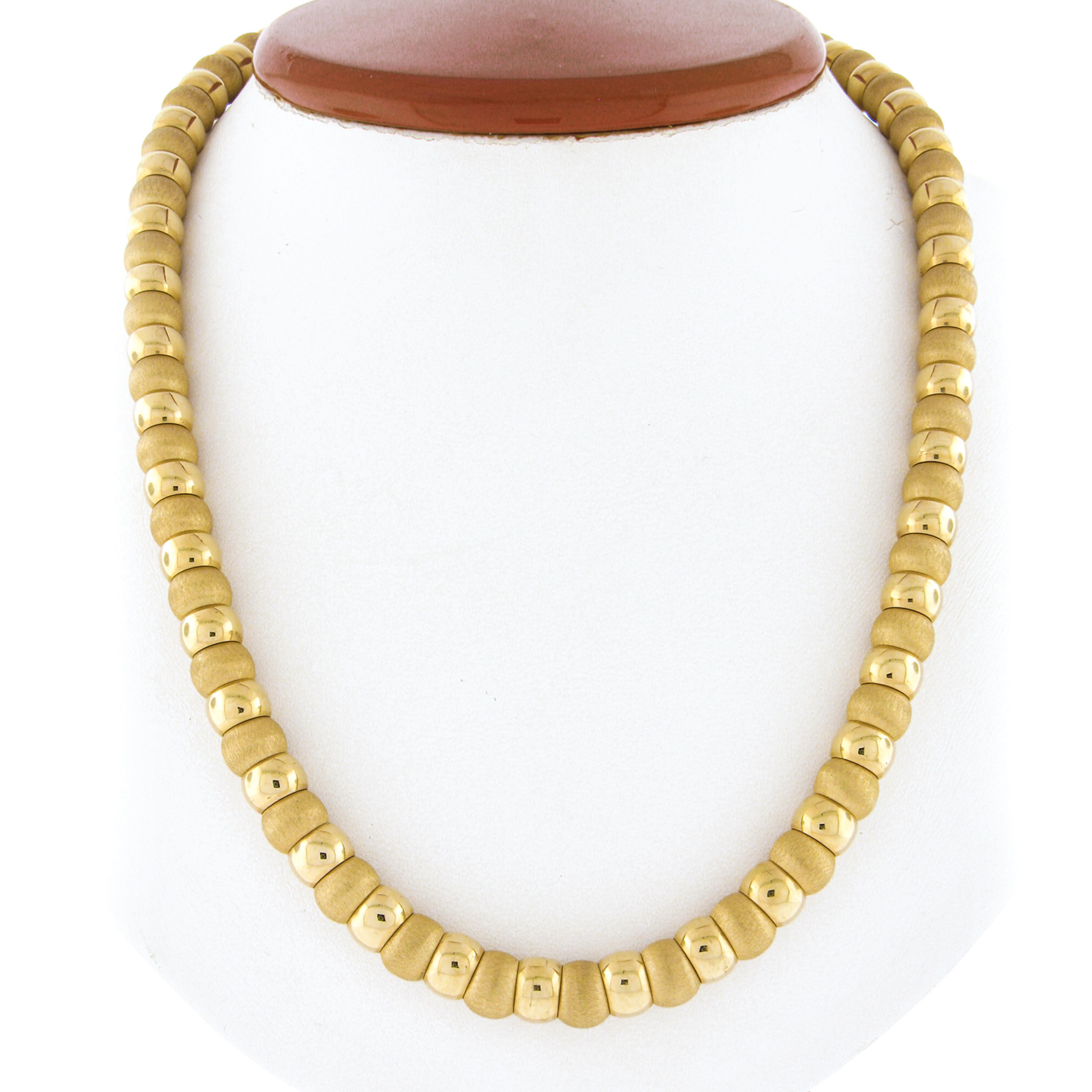 Here we have an absolutely gorgeous necklace by Milor that was crafted in Italy from solid 18k yellow gold. This very well made piece features gold ball beads that have a fine brushed finish throughout and alternate with high polished links of which