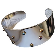 Brazalete modernista Milor Italia de acero inoxidable y oro de 18 quilates de color con piedras preciosas
