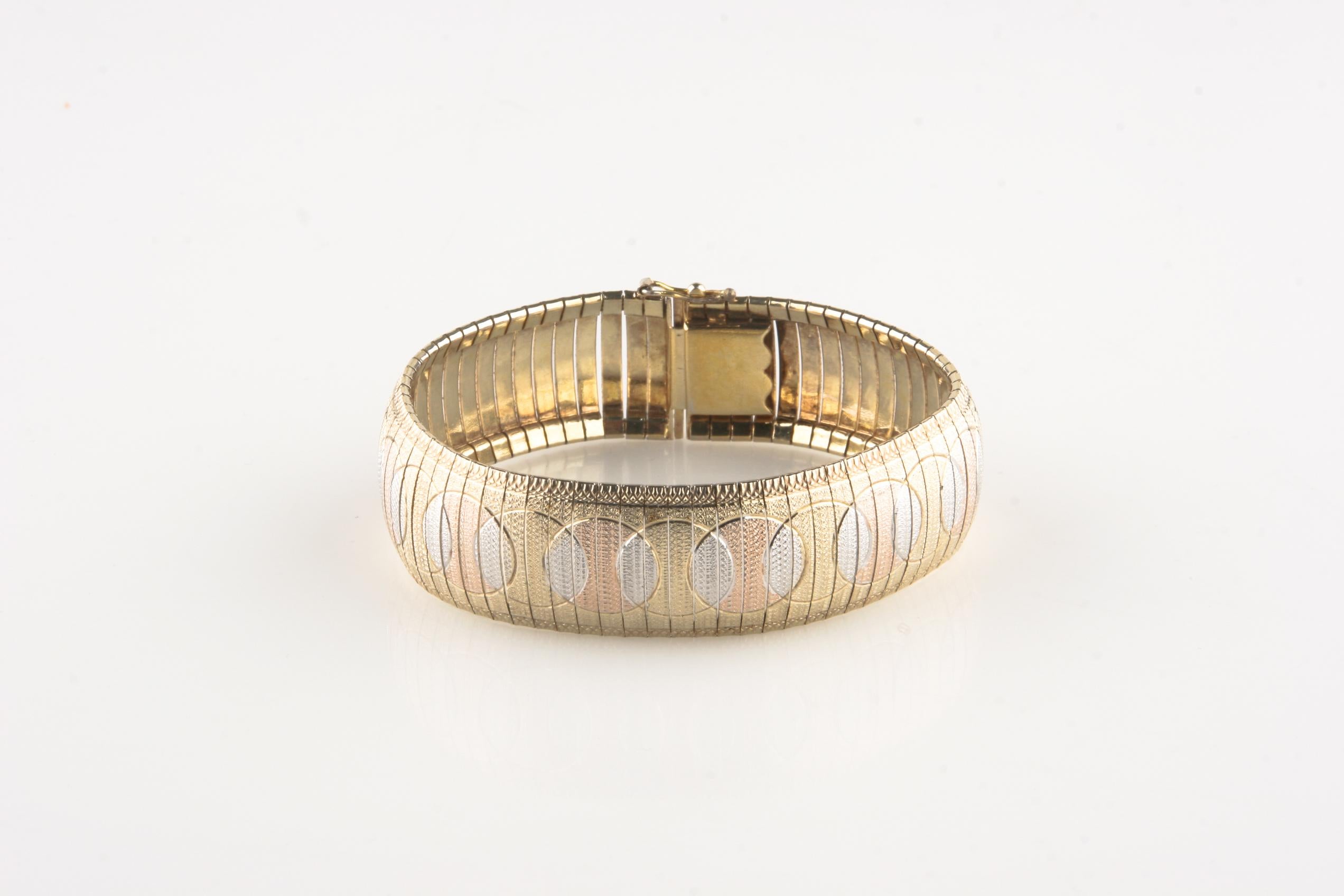 Vintage item from the 1980s.
Made from 925 sterling silver, rose gold vermeil, and yellow gold vermeil.
Dimensions 7 1/2 inches by 3/4 inches.
Weight 28.7 grams (approximately).
Milor made in Italy with 925 hallmark/stamp.