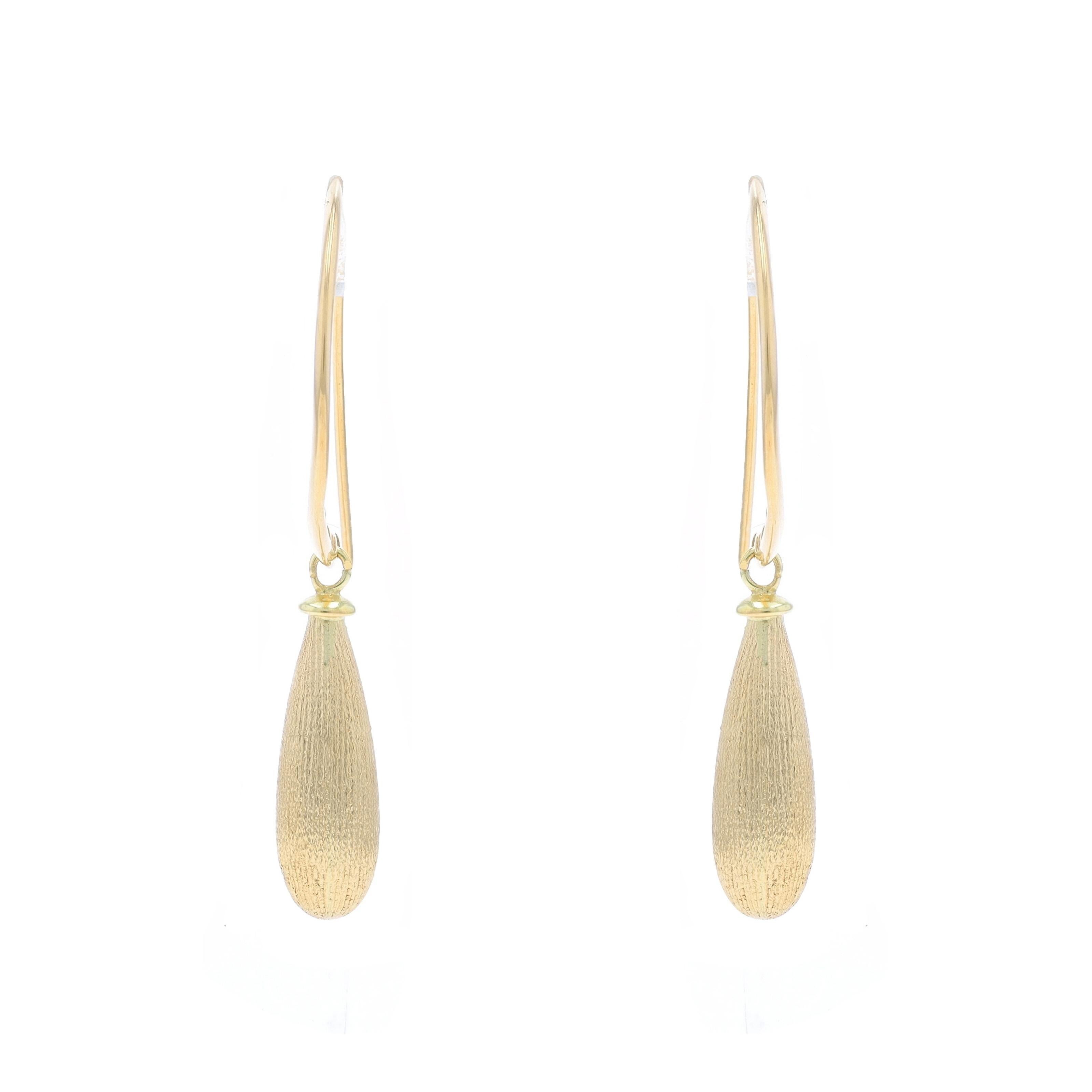 Brand: Milor

Metal Content: 18k Yellow Gold

Style: Dangle
Fastening Type: Hook Closures
Theme: Teardrop
Features: Smoothly Finished with Brushed Detailing on Hollow Dangles

Measurements

Tall: 1 1/2