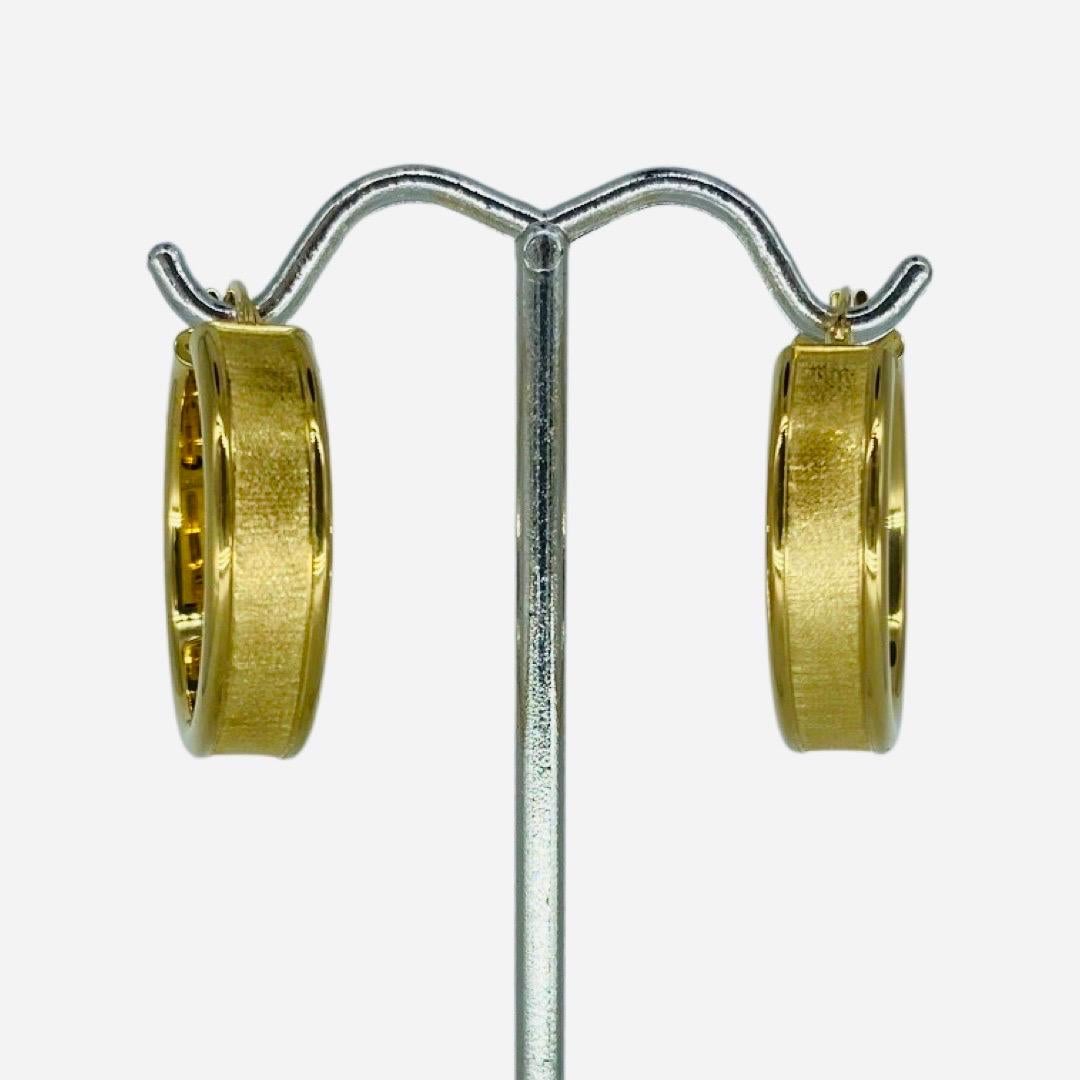 Vintage Satin Finish 18 Karat Gold Hoop Earrings 
Very elegant designed earrings. The earring's width is 6.50mm and the diameter is 24mm. The earrings weight 3.1 grams solid 18 karat hold. Made by Milor