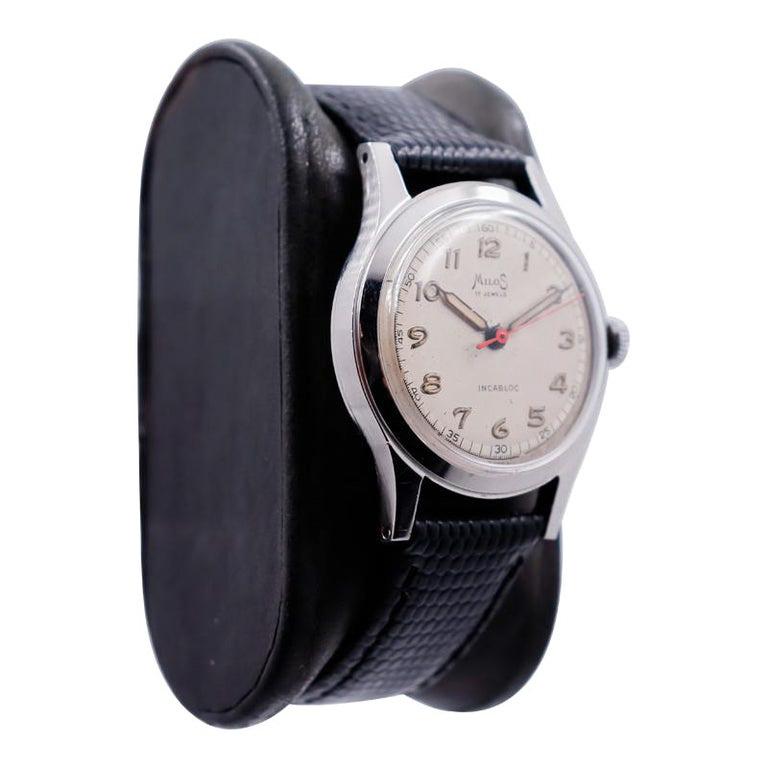 FACTORY / HOUSE: Milos Watch Company
STYLE / REFERENCE: Round Art Deco 
METAL / MATERIAL: Stainless Steel 
CIRCA / YEAR: 1940's
DIMENSIONS / SIZE:  Length 38mm X Diameter 30mm
MOVEMENT / CALIBER: Manual Winding / 17 Jewels 
DIAL / HANDS: Original