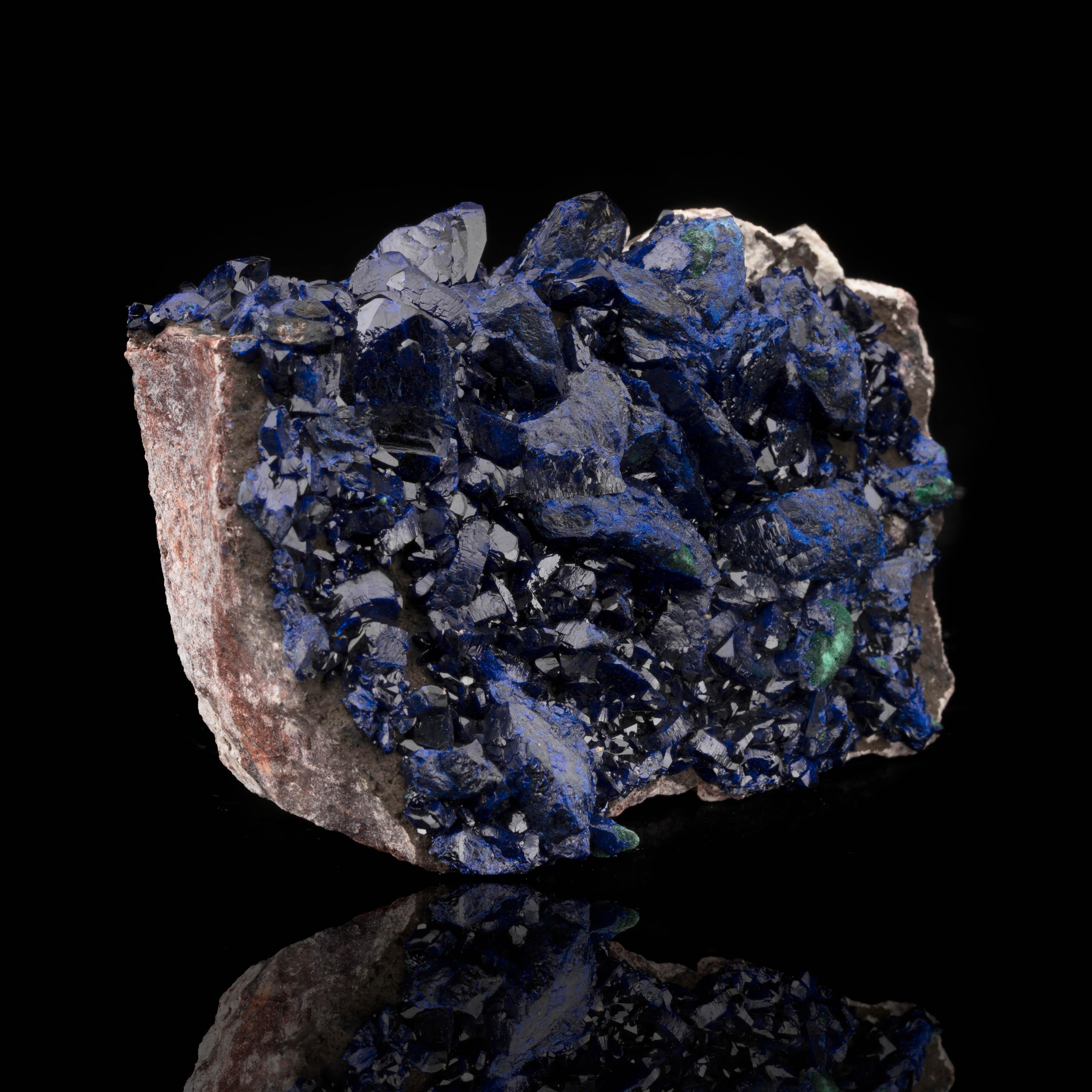 Azurites from the Milpillas mine in Zacatecas, Mexico are famous for their exceptional deep blue pigmentation and beautifully formed crystals. This significantly sized specimen of the rare secondary copper carbonate mineral features large, fully