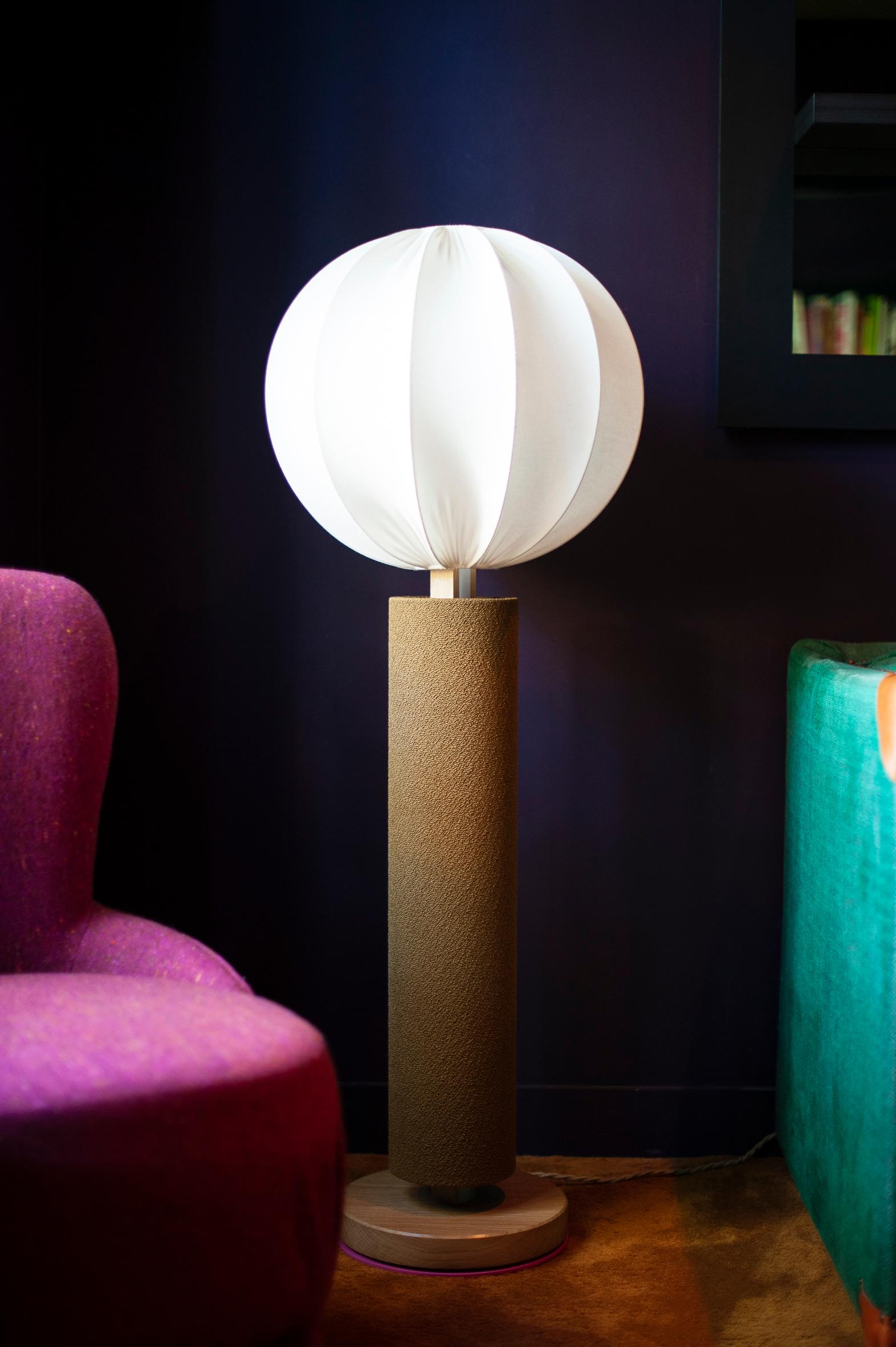  MIMA#1: Ball lampshade in the upper part /

The MIMA model is soft, elegant. It will dress up your interior and add a touch of fantasy.
This lamp will represent a centrepiece in your decoration.

Inspired by the 70s, Angélique Delaire designed the