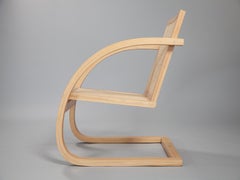Mima Armchair. Handcrafted from solid reclaimed ivory wood. Showroom sample