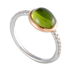 MIMÍ 18 Karat White and Rose Gold Diamond and Peridot Oval Ring