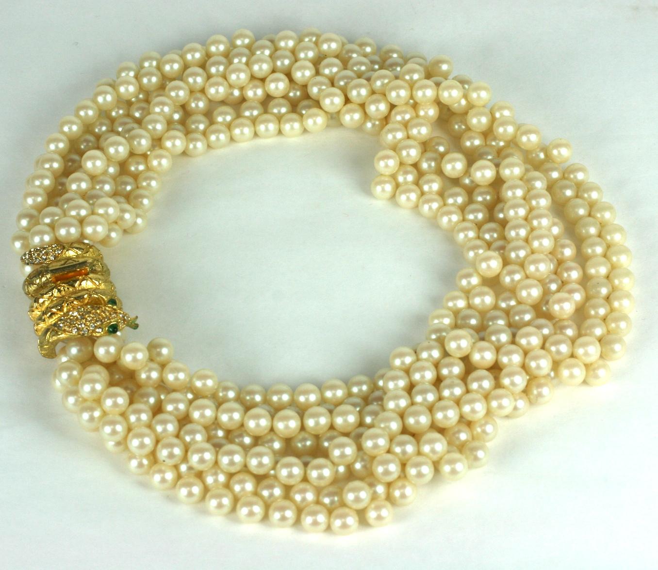 Striking Mimi di Nardo Snake Clasp Pearls from the 1960's with multiple strand of faux pearls with gilt coiled snake clasp with faux emerald eyes. Approx 19