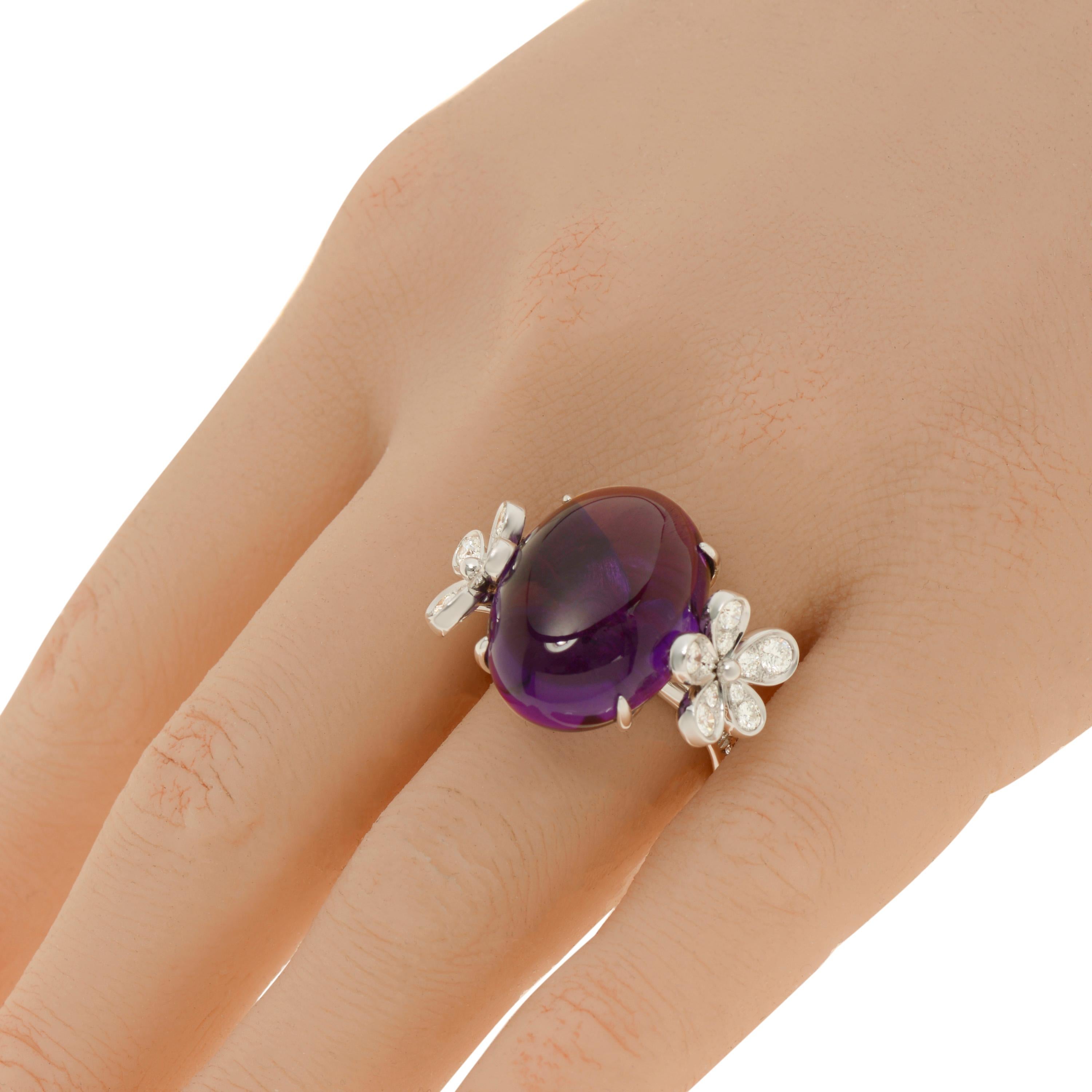 Mimi Milano 18K white gold statement ring features amethyst center with 1.14ct. tw. diamonds set in delicate floral design. The ring size is 6.5 (53.1). The decoration size is 1 1/8