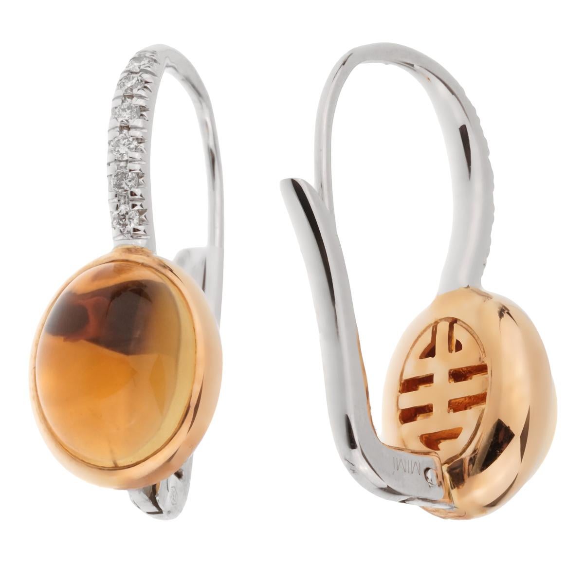 A stunning set of Mimi Milano drop earrings showcasing 18k rose gold wrapped around 6.29ct of citrine adorned with shimmering round brilliant cut diamonds in white gold.

Sku: 2498