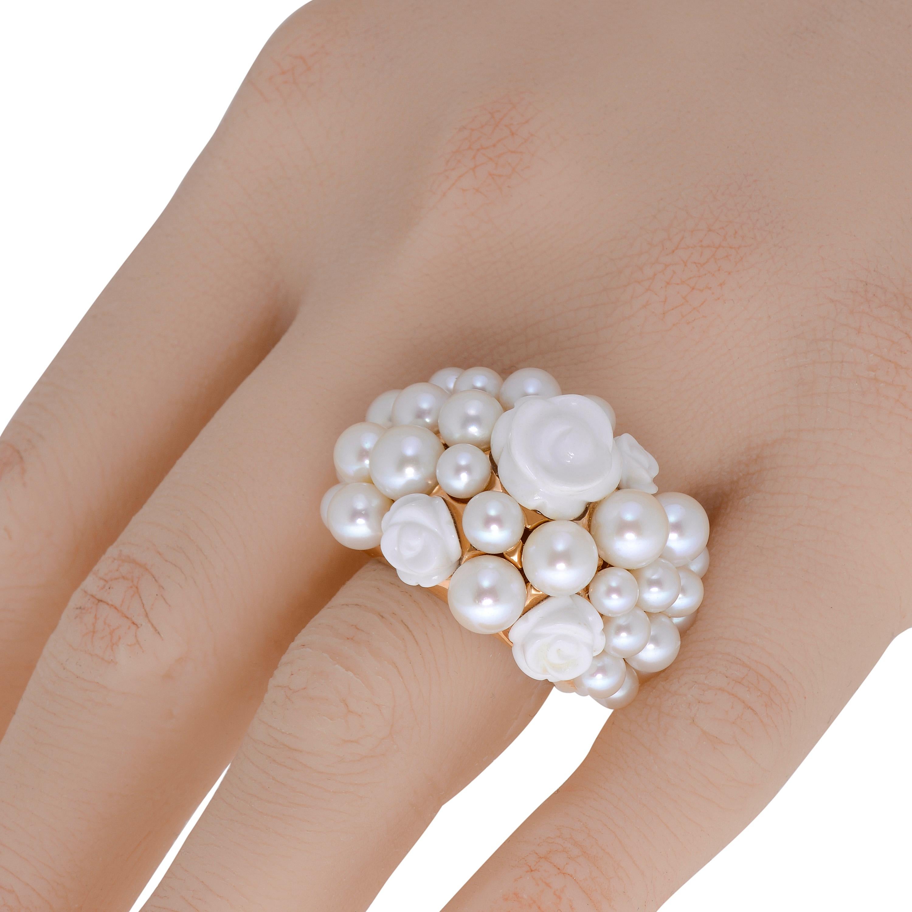 This ornate Mimi Milano 18K rose gold cocktail ring features 4-6mm cultured pearls elevated with 8.04ct. tw. White Agate roses. The ring size is 7.75. The band width is 6mm. The weight is 27g.
