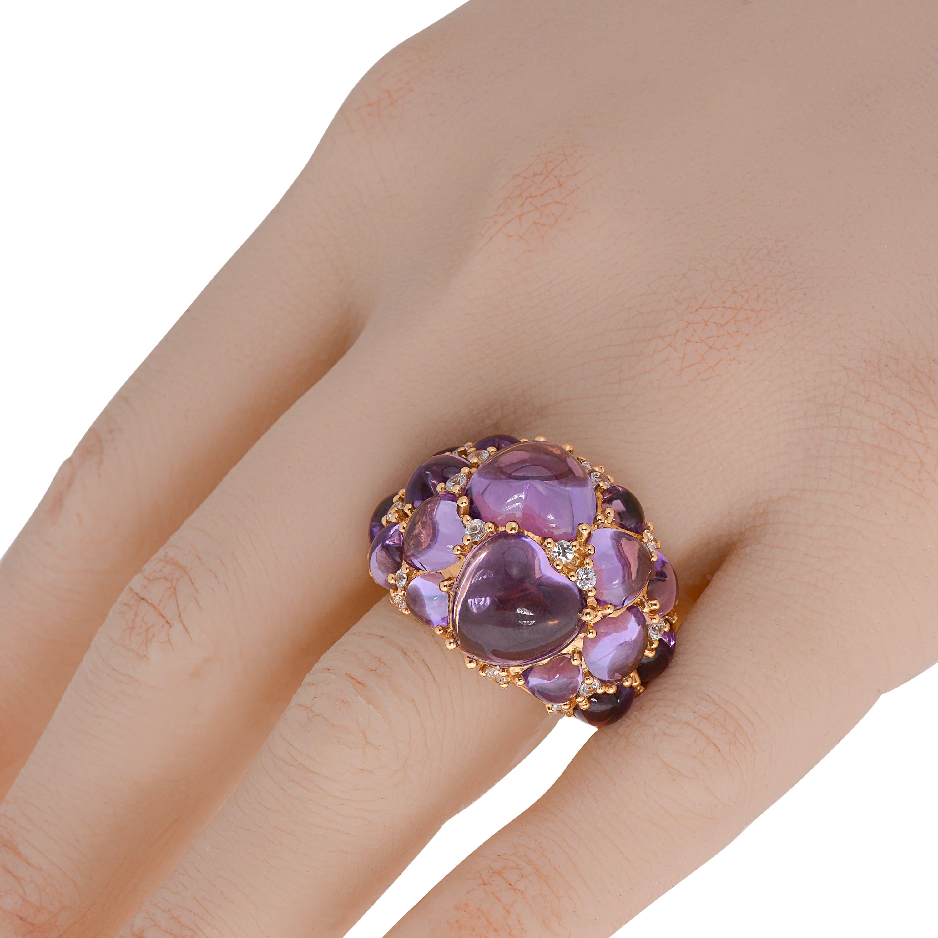 This show-stopping Mimi Milano 18K rose gold cocktail ring features 21.15ct. tw. cabochon amethyst hearts with shimmering 0.75ct. tw. prong set white sapphires. The ring size is 6.25. The band width is 6mm. The weight is 18g.

