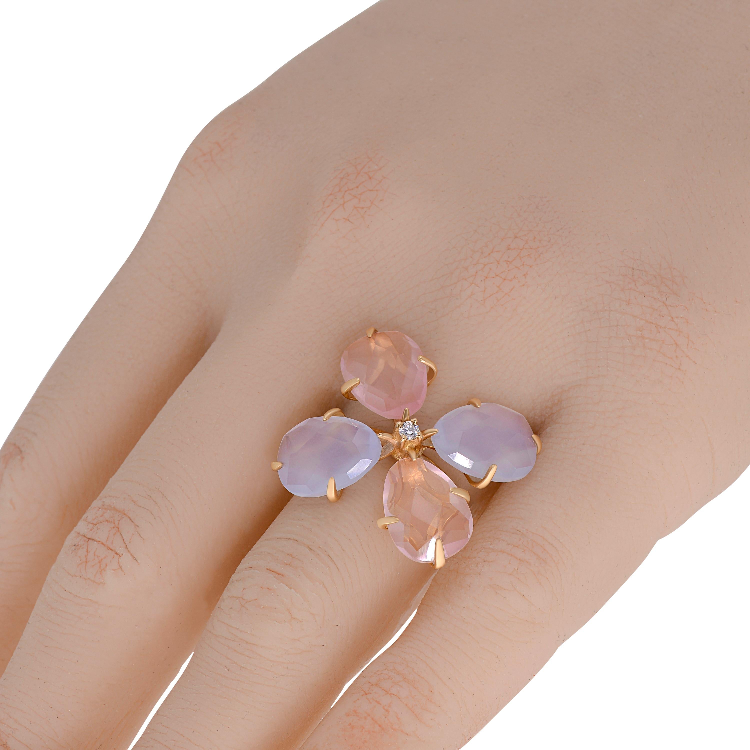This bejeweled Mimi Milano 18K rose gold statement ring features a glittering 0.04ct. tw. diamond accent with faceted chalcedony and rose quartz petals. Semi-precious weight is 12 ct. tw. . The ring size is 6.55. The decoration size is 7/8