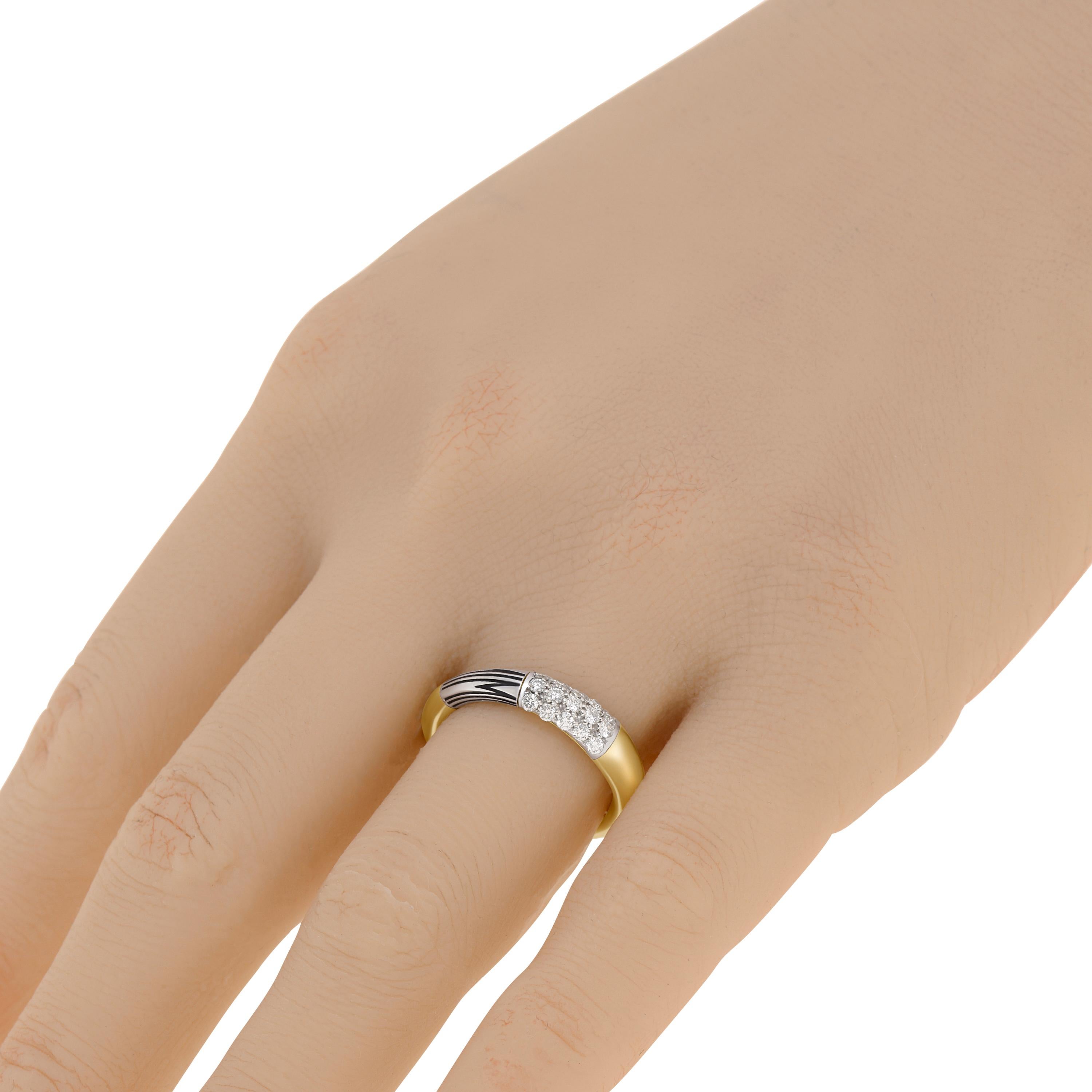 Mimi Milano 18K yellow gold and 18K white gold band ring features an elegant combination on 18K Yellow and white gold and 0.3ct. tw. diamond with letter 