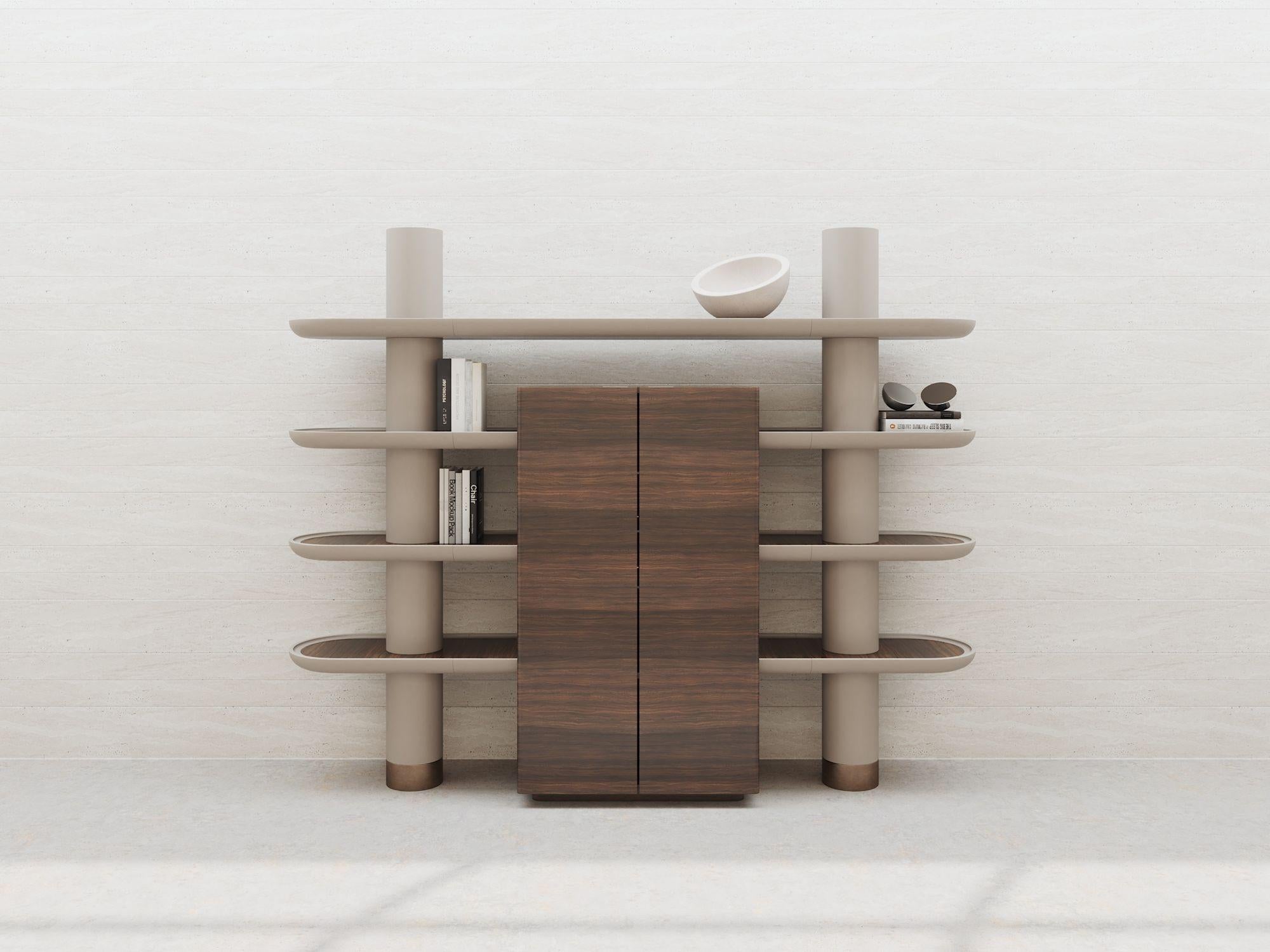 Majestic and refined, this wall unit was conceived as an artful and elegant solution simultaneously serving as bookcase and cabinet. Four wide shelves marked by curved extremities are held together by bold color-coordinated columns whose bases are