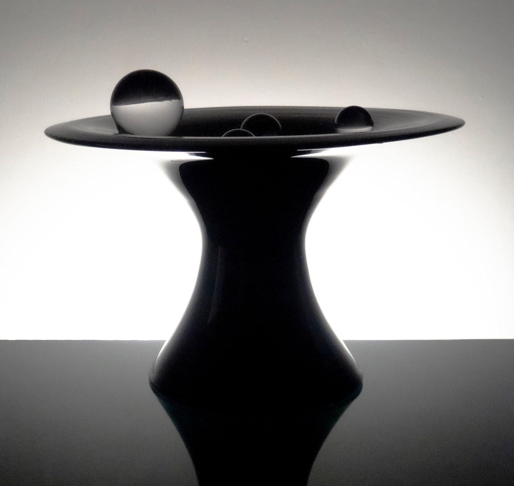 Black and white glass table sculpture -- "Gravitational Portal"