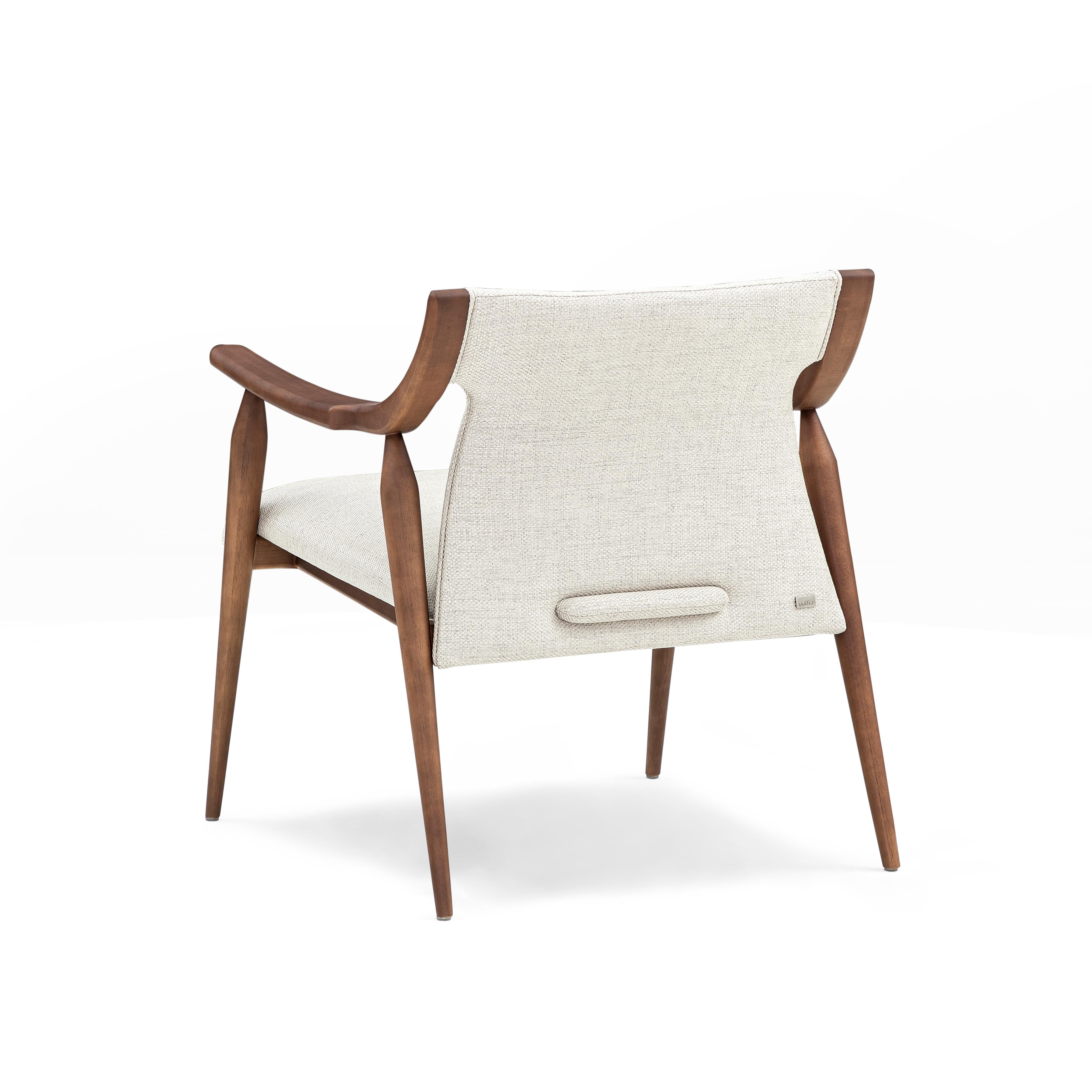 The Mince armchair is a welcoming addition to any room in your modern home decor with its walnut finish curved arms and spindle legs, and an off-white beautiful and soft fabric for the cushions. This modern chair has a clean minimalist simple design