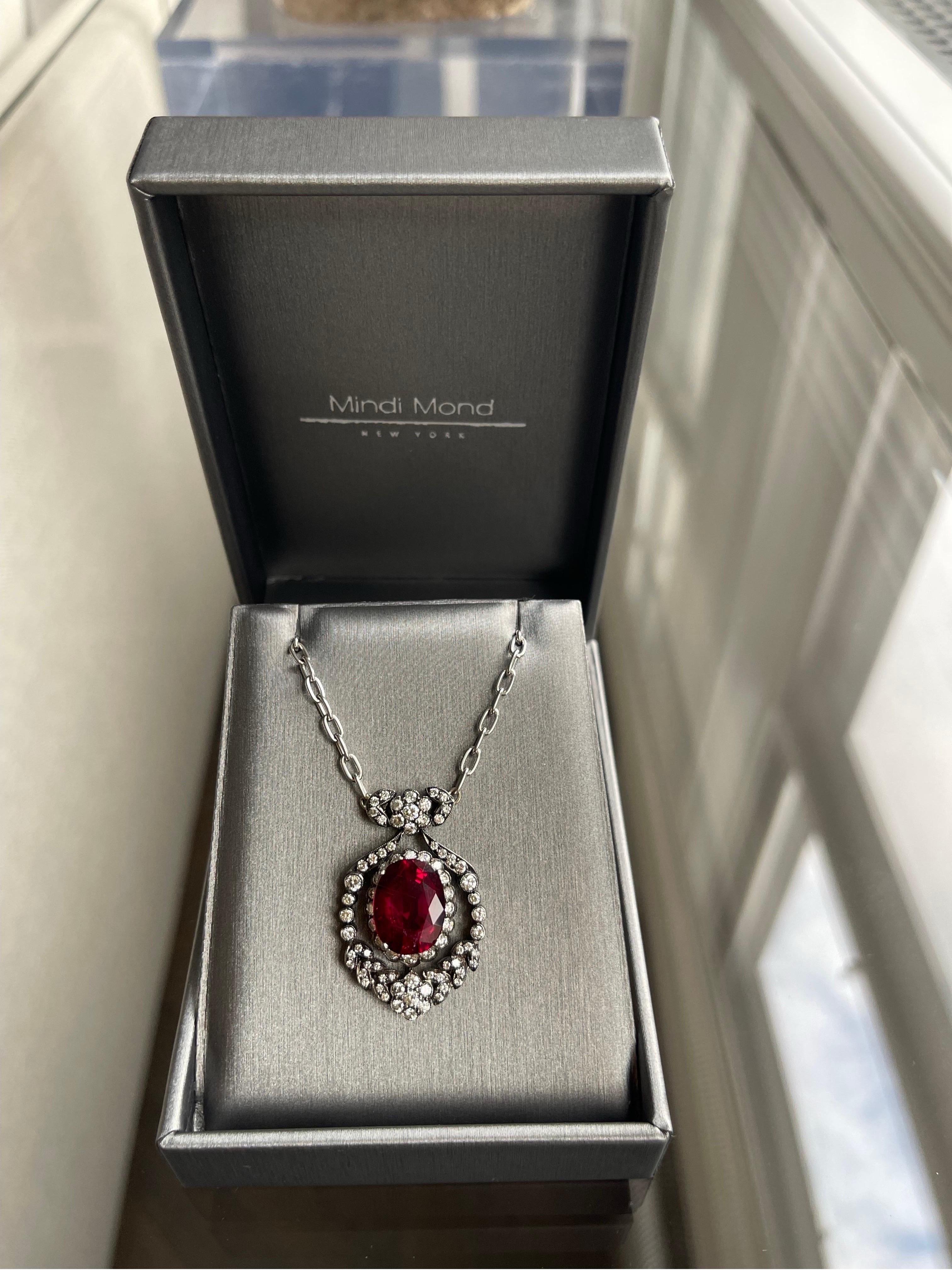 6.58 CTW Rubellite Tourmaline and 1.40 CTW Round Brilliant Diamonds set in Silver and hung on an 18k White Gold oval link chain. 18-1/4 inches long.