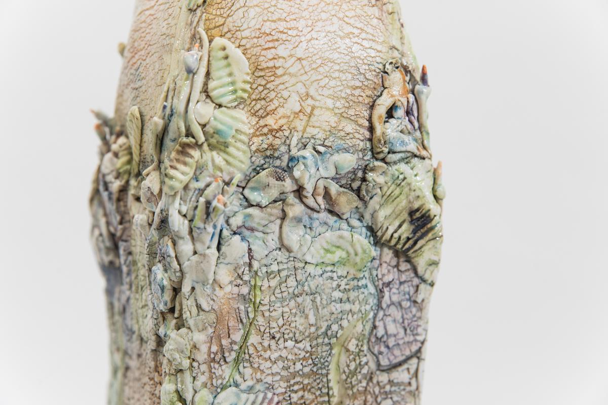 Mindy Horn’s non-functional vessels, purposely thrown off center, appear to have grown and weathered organically. The surfaces of the vessels, crusty or cracked, emphasize their crooked, uneven forms. While their appearance seems to contradict