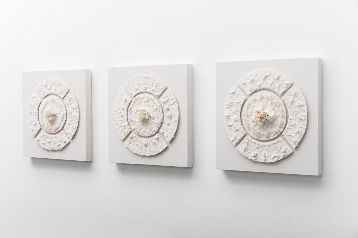Several themes appear often in Horn’s work, the most central being multiplicity.

Horn’s meticulously constructed wall reliefs are composed of minuscule, seemingly identical pieces. Within the medallions, each tiny, hand-formed component’s