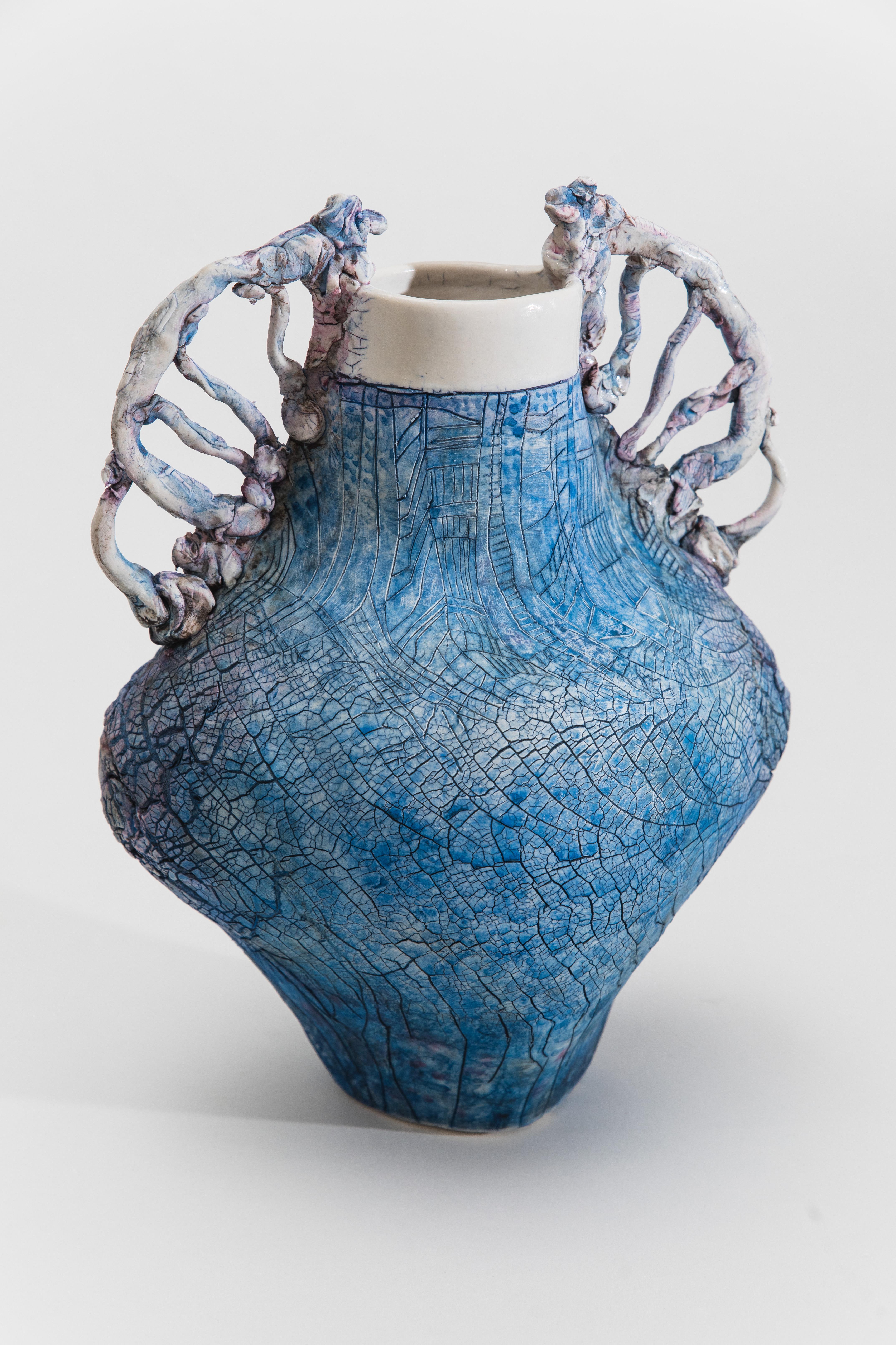 Mindy Horn’s non-functional vessels, purposely thrown off center, appear to have grown and weathered organically. The surfaces of the vessels, crusty or cracked, emphasize their crooked, uneven forms. While their appearance seems to contradict