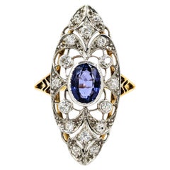 Ring aus 18 Karat Gelbgold und Platin mit Diamanten im Minenschliff und Tansanit