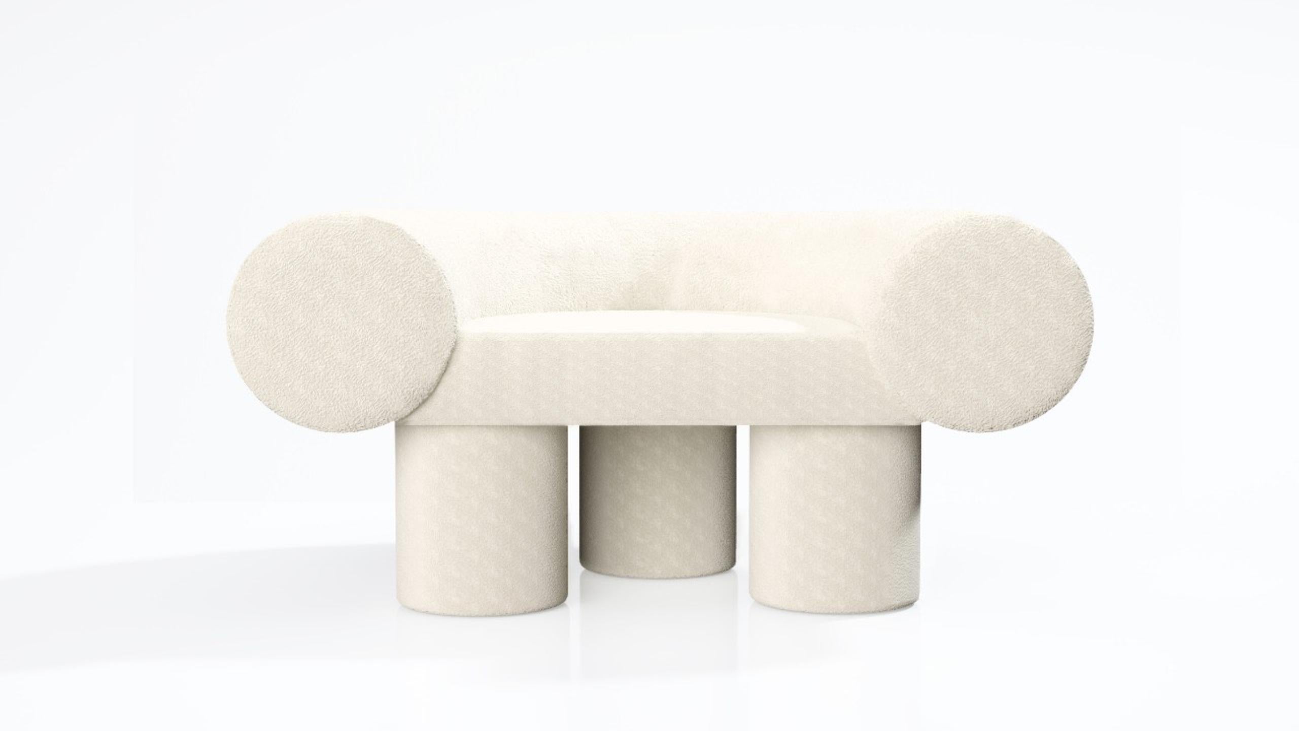 This armchair is the result of a research linking minimalist design and natural components, in the respect of the true values of Kasadamo ; unique and high-end design. This version is with bouclé cream fabric. Naturally, you can choose the fabric