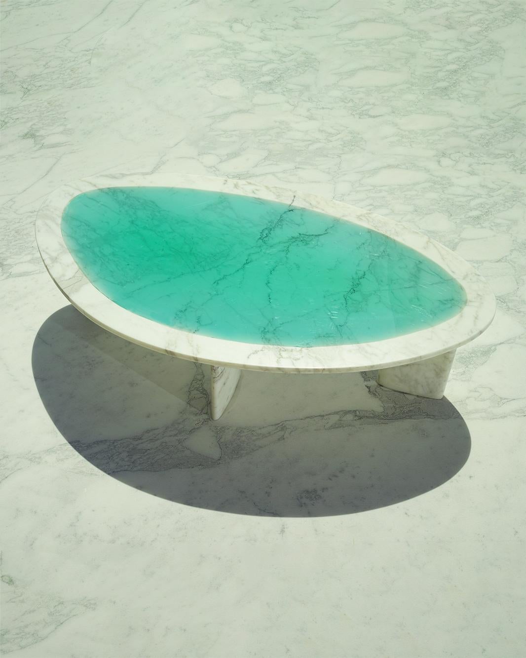 Minerals Turquoise Low Table by Carla Baz
Entirely handcrafted in solid marble with resin inlay.
Dimensions: L 136 x W 75 x H 35/45 CM
Weight: 65 kg
Material: Brescia Viola Marble, resin.
Also available in other shapes: round, rounded square.

The