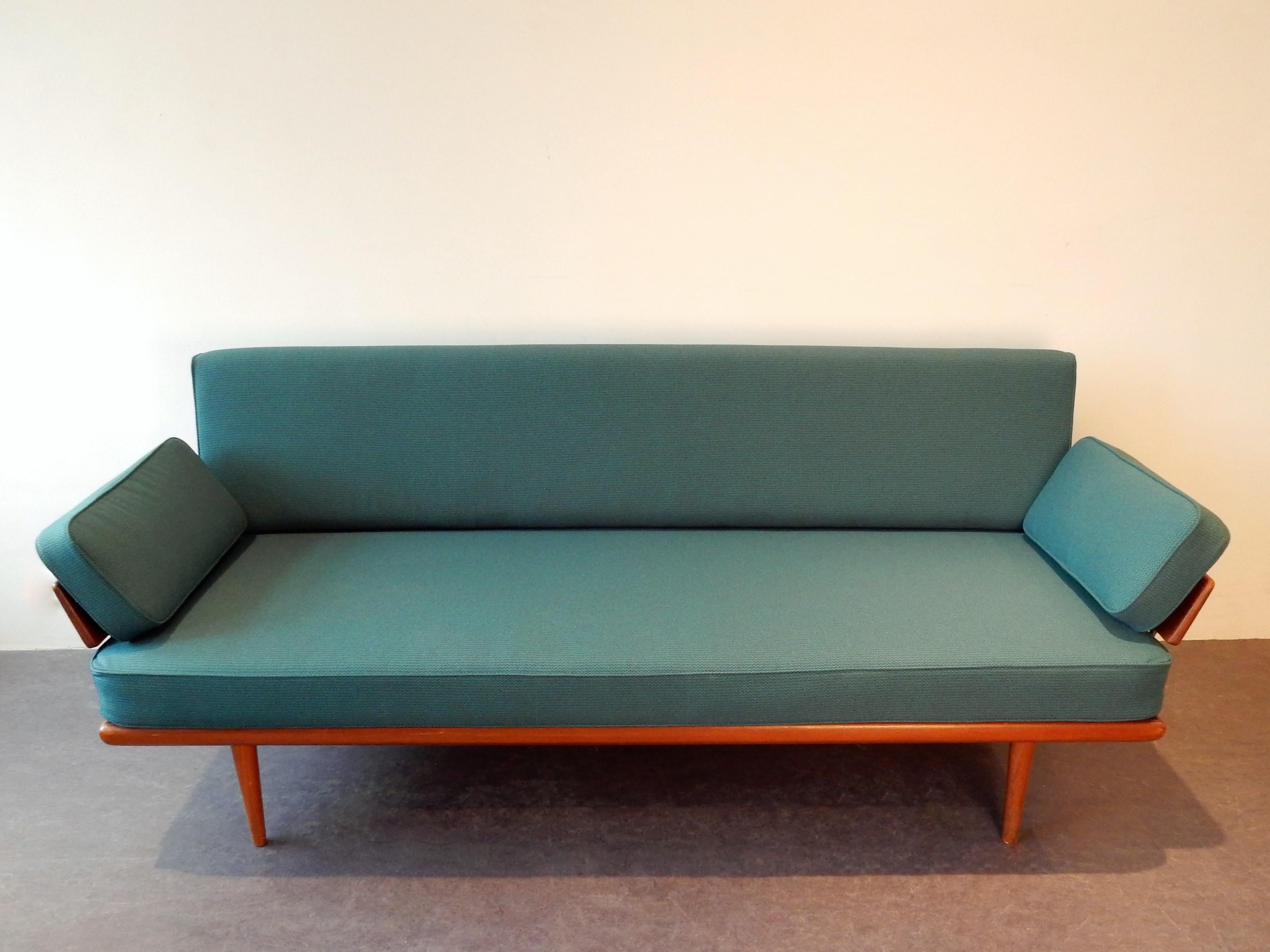 This 3-seat sofa is a beautiful design by Peter Hvidt and Orla Mølgaard Nielsen for France & Son in the 1950s. It has a teak frame with chrome parts. The seating cushion and armrest cushions are original spiral springs and the back rest is of new