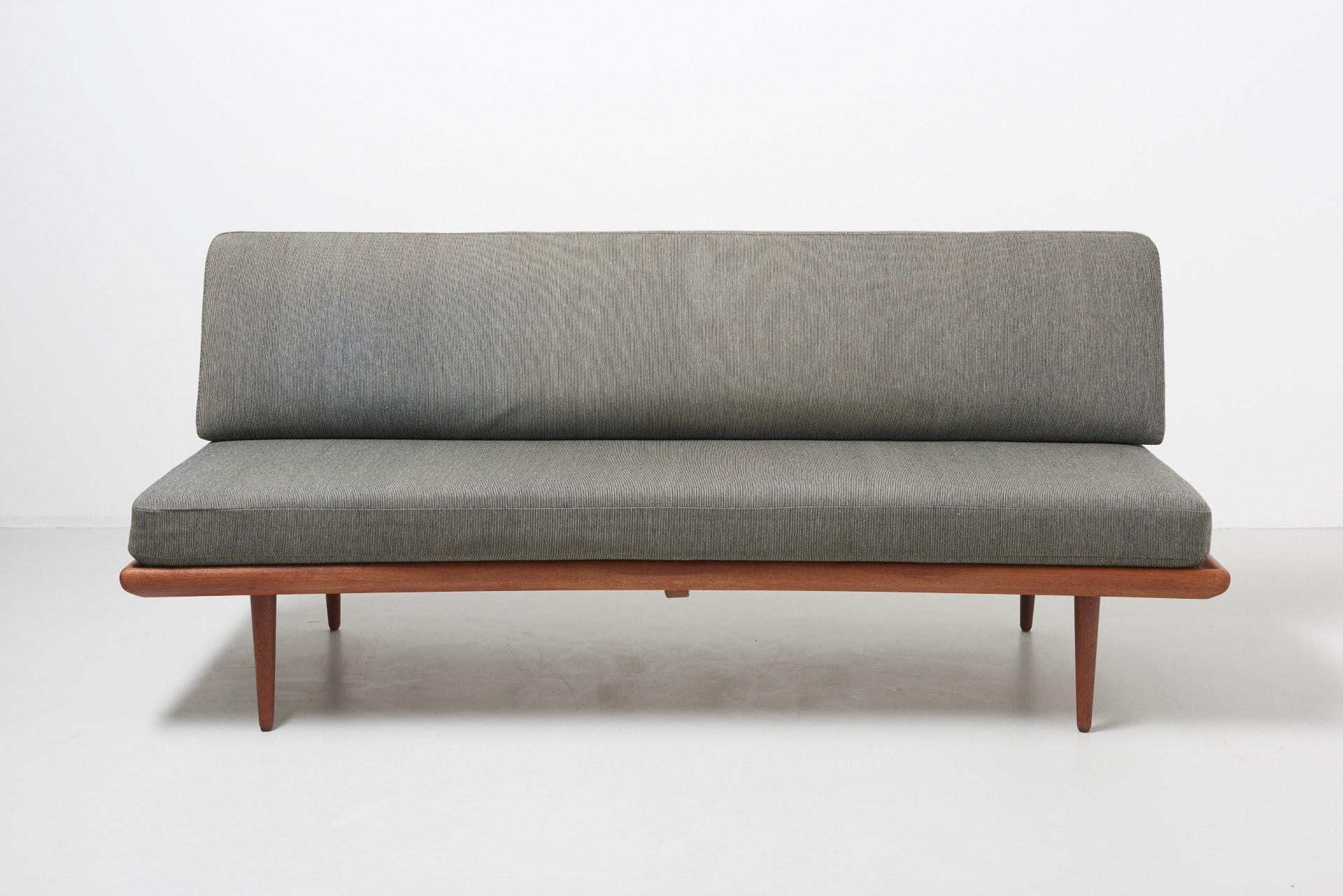 Minerva daybed in solid teak with the original upholstery. The foam has been replaced.
Design by Peter Hvidt and Orla Mølgaard Nielsen in 1957. Produced by France and Son, in Denmark.