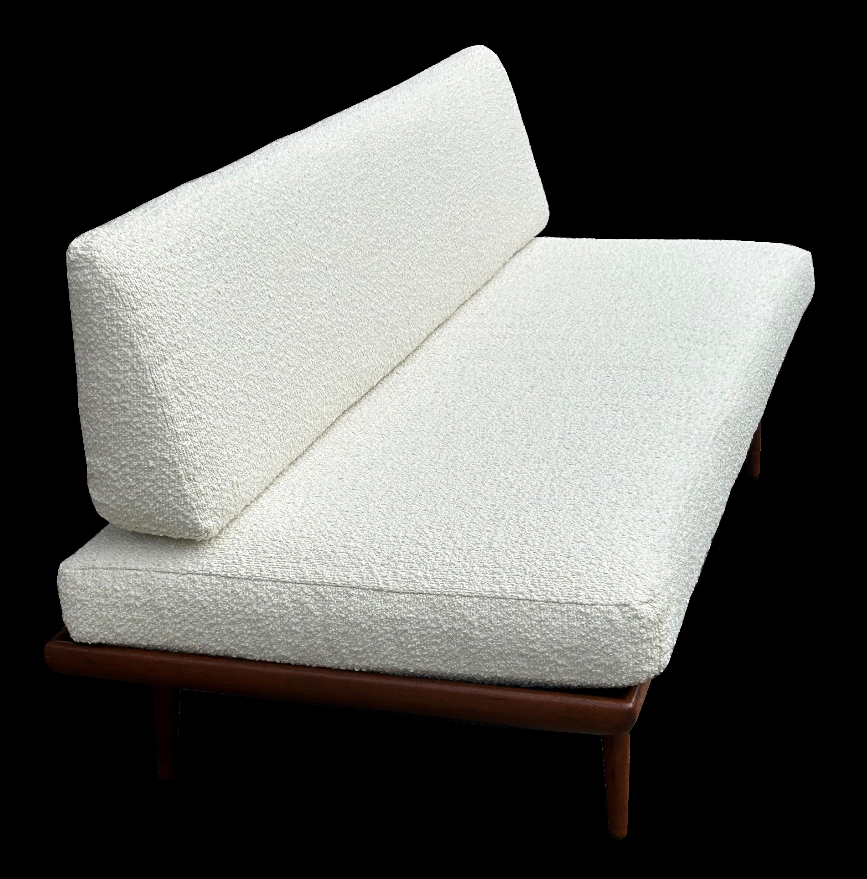 An excellent example of classic Scandinavian modern daybed, best quality Teak and freshly reupholstered in white boucle.
