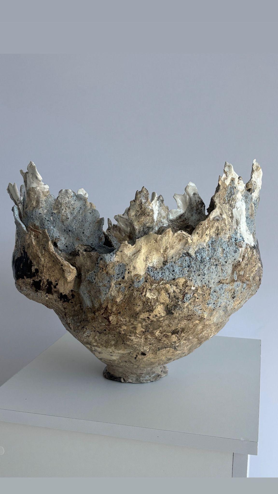 Vestalia – The Three Sisters of Ash and Time
The last stands sculptural and weathered, yet undeniably powerful. She is Minerva—goddess of wisdom, strategy, and the arts. Her presence carries the weight of thought and creativity, a mind both sharp