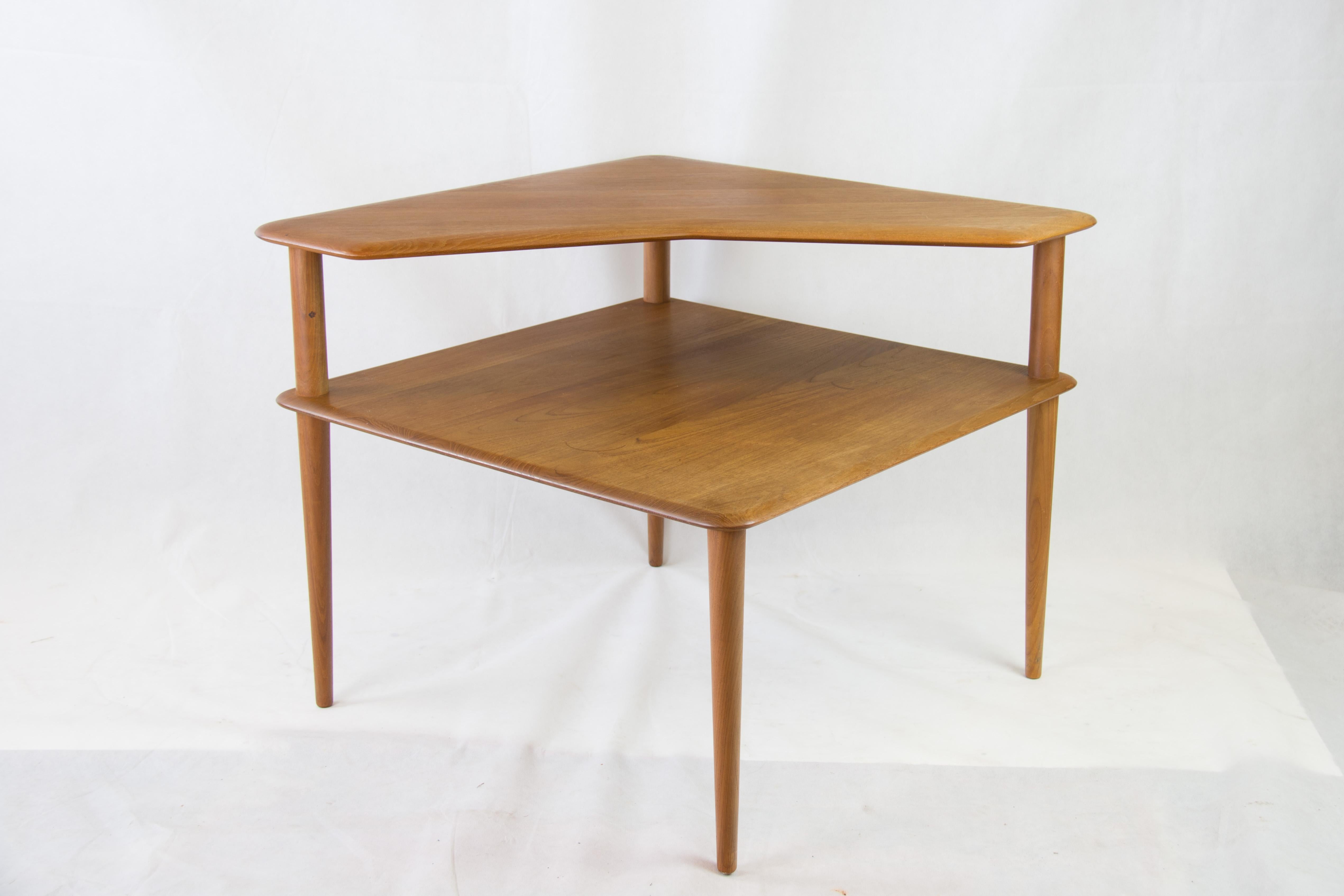 Beautiful square Side table in solid teak designed in 1957 by Designer Duo Peter Hvidt and Orla Molgaard Nielsen 
manufactured by famous company France & Son
conical legs and two shelves. 
The model is called Minerva . It is stamped with the