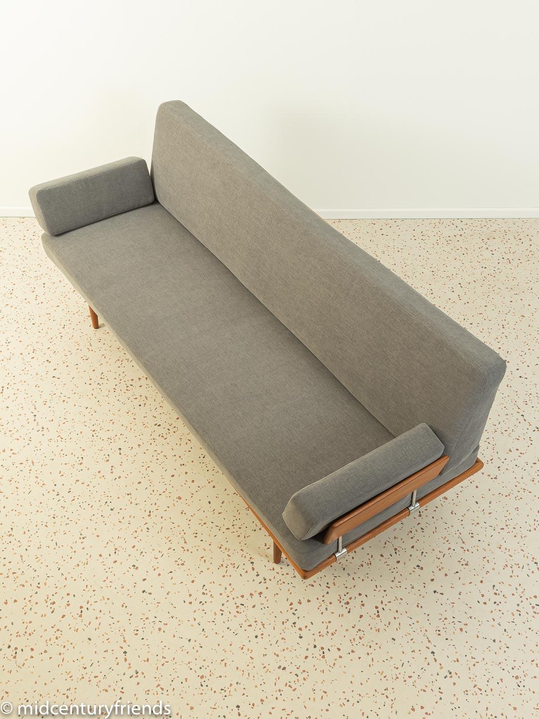 Wonderful Minerva sofa by Peter Hvidt & Orla Mølgaard-Nielsen from the 1960s. Solid teak frame with two armrests. The original spring core has been reupholstered and covered with a high-quality fabric in grey.

Quality features:
- accomplished