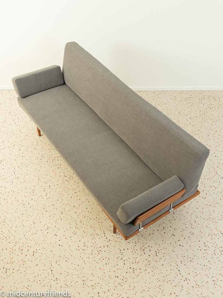 Wonderful Minerva sofa by Peter Hvidt & Orla Mølgaard-Nielsen from the 1960s. Solid teak frame with two armrests. The original spring core has been reupholstered and covered with a high-quality fabric in grey.

Quality features:
- accomplished