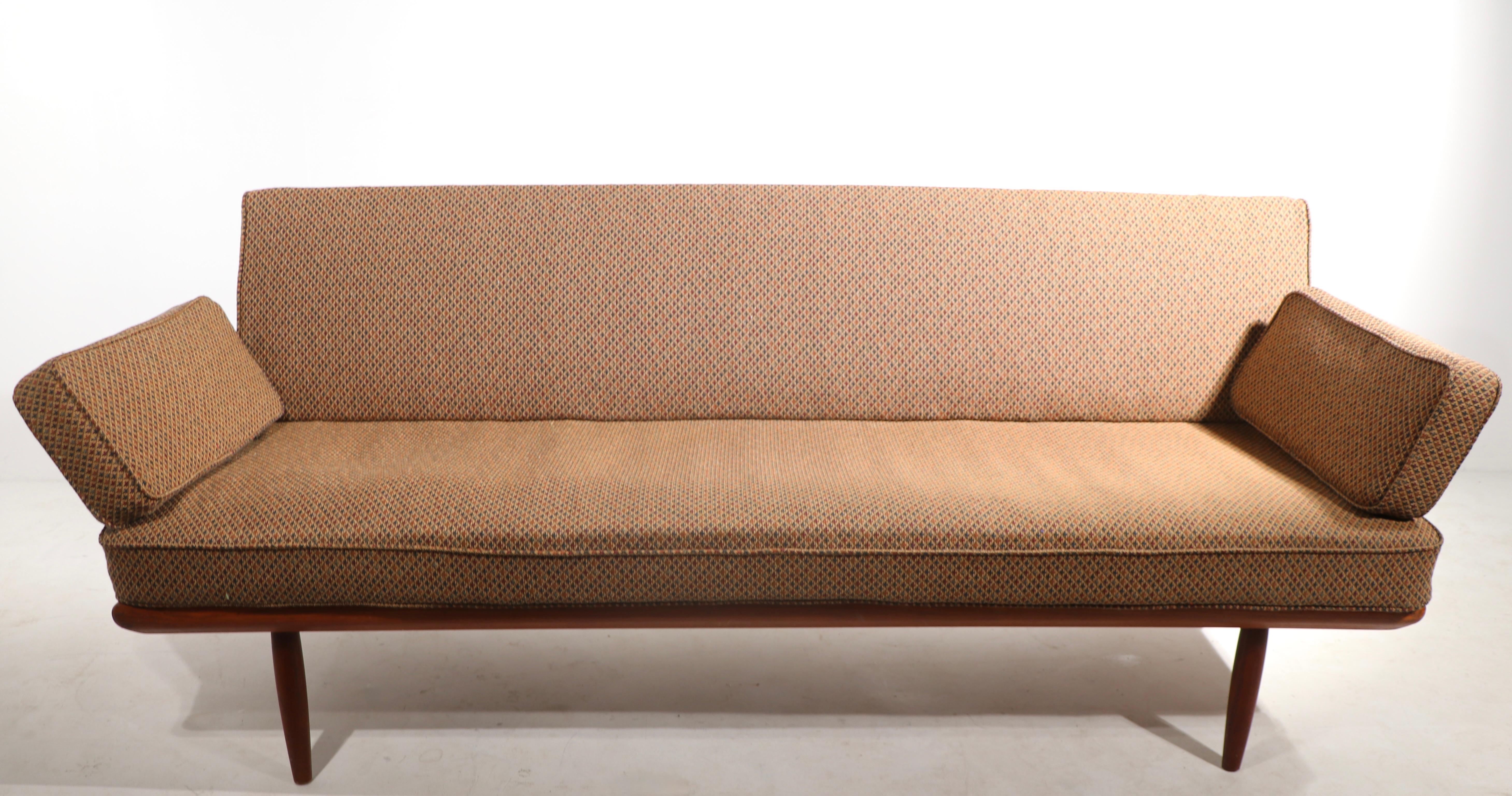 Truly a design icon, the Minerva sofa, daybed designed by Peter Hvidt and Olga Molgaard, executed in teak, and upholstery. The sofa has removable arms, to convert into a daybed. This example is in very good, original condition, clean and ready to