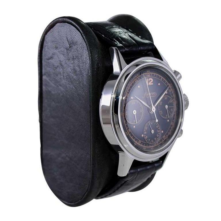 FACTORY / HOUSE: Minerva Watch Company
STYLE / REFERENCE: Chronograph
METAL / MATERIAL: Stainless Steel
CIRCA / YEAR: 1940's
DIMENSIONS / SIZE:  Length x Diameter
MOVEMENT / CALIBER: Manual Winding / 17 Jewels 
DIAL / HANDS: Black with Rose Gold